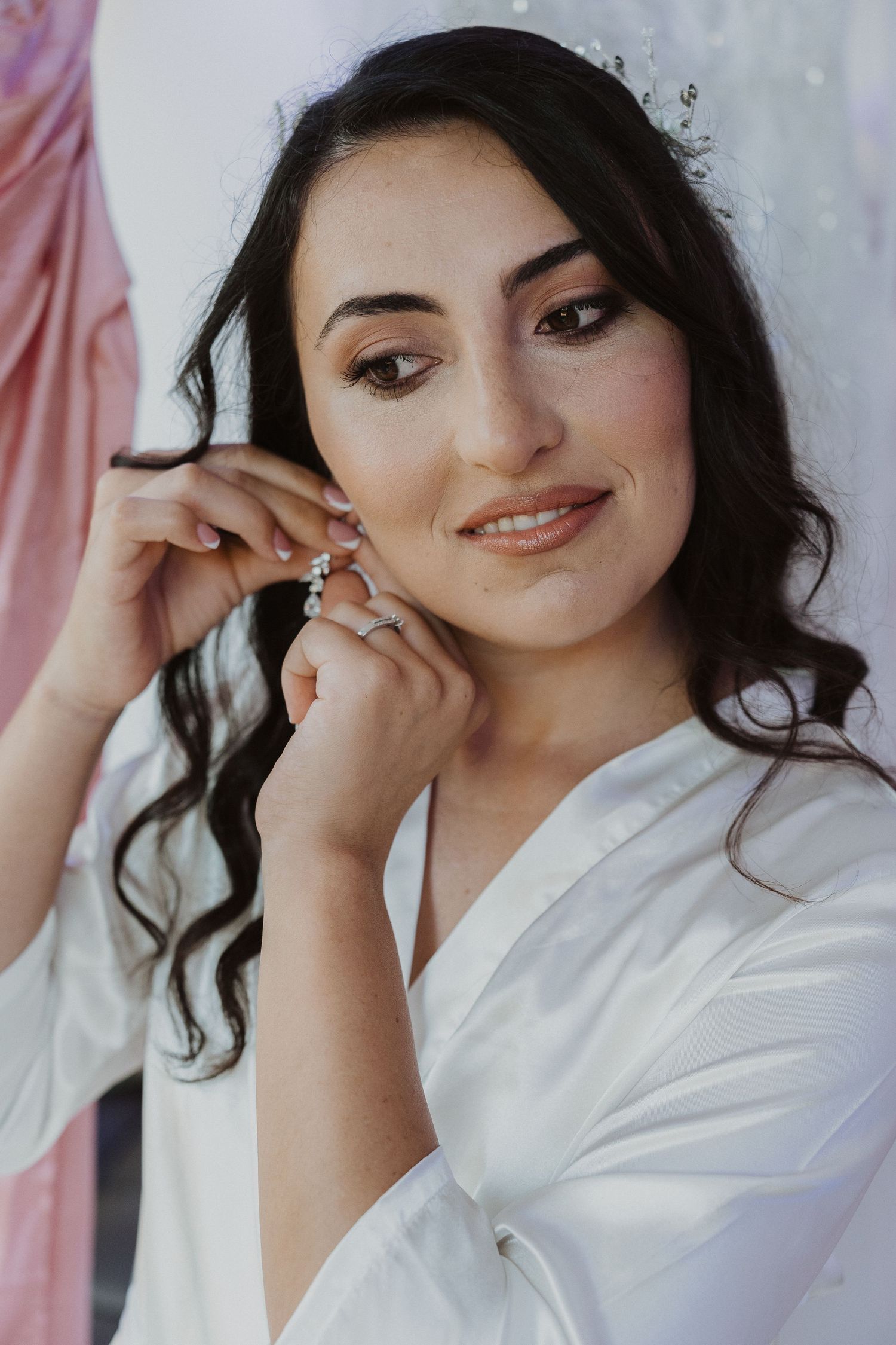 A close-up portrait of a bride getting ready for her wedding day.