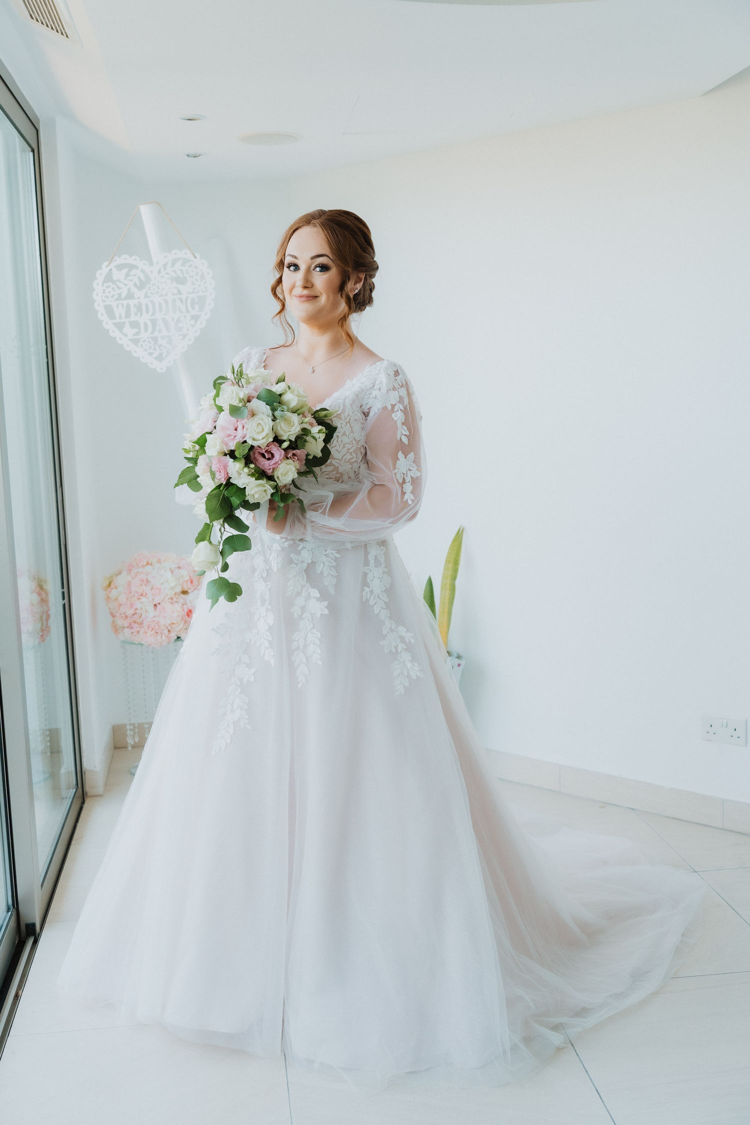 Close-up bridal portrait showcasing intricate lace details and soft makeup.