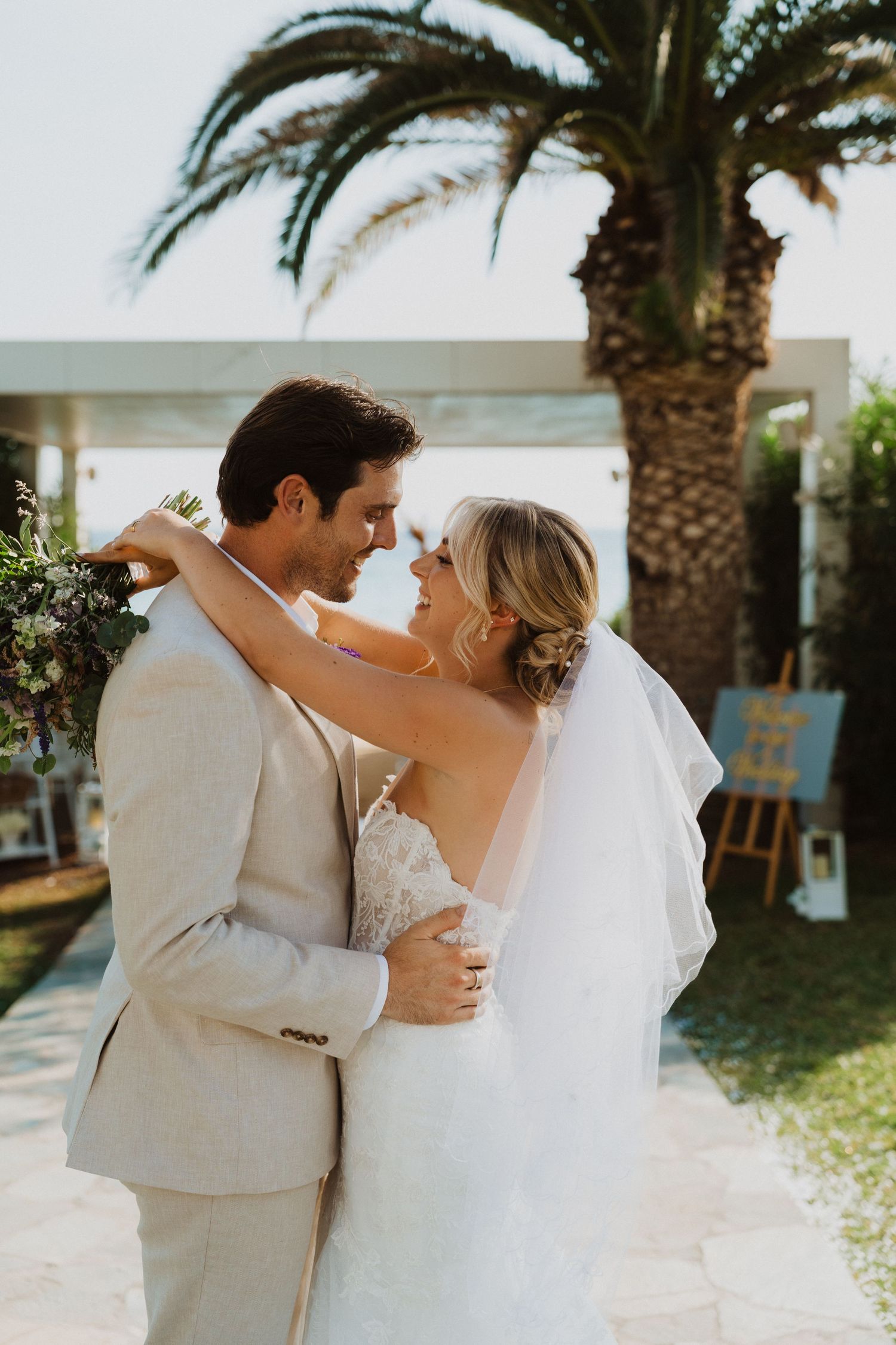Wedding couple shares romantic dance moves during their beachside celebration.