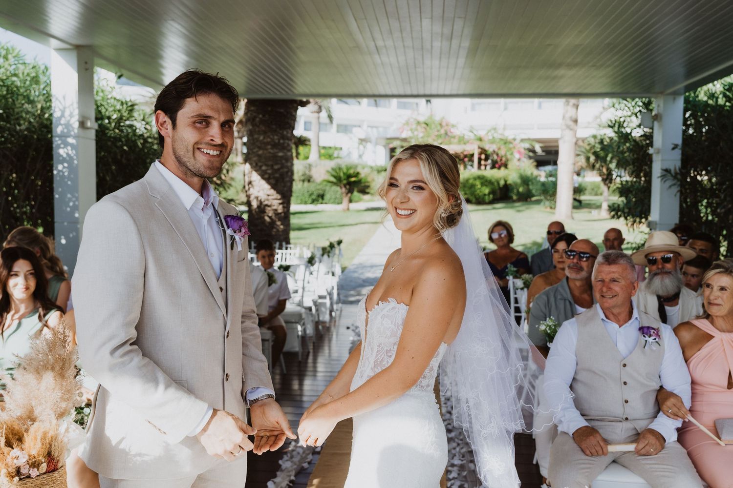Sequence of candid wedding moments showing celebration under an elegant outdoor pavilion.