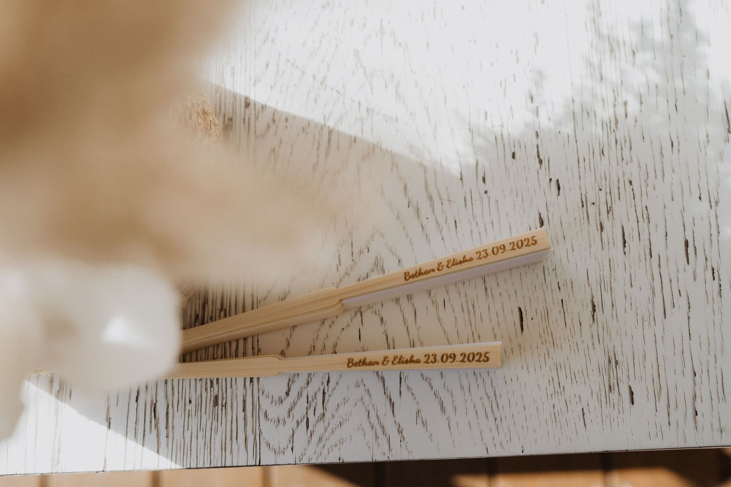 Close-up detail shot of a wooden surface with text visible.
