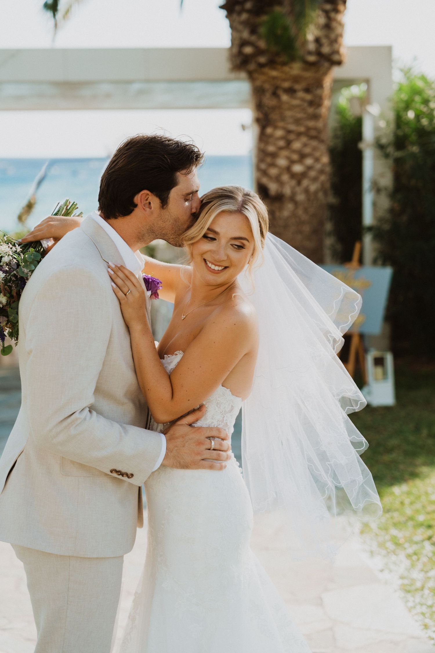 Newlyweds share joyful embraces in a series of candid wedding photos outdoors.