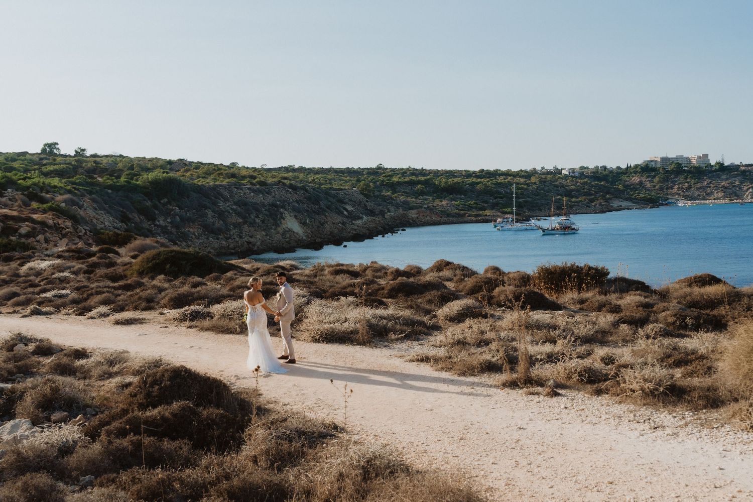 Scenic coastal path with Mediterranean waters and rocky cliffs in Cyprus.