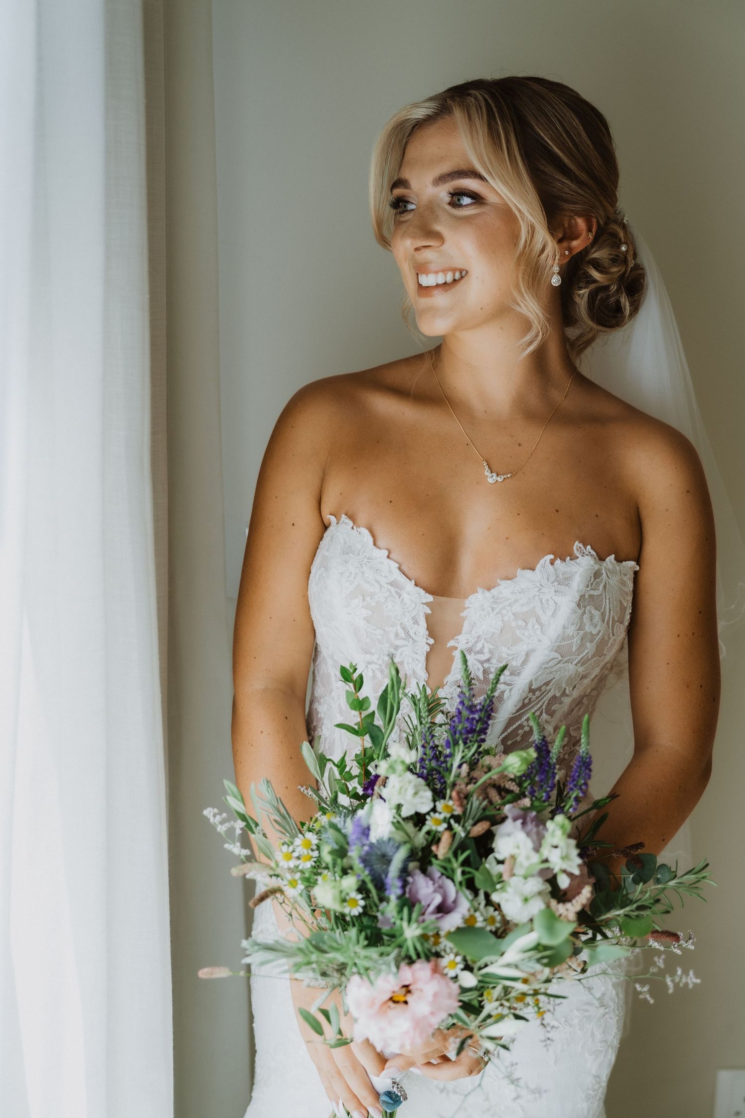 Candid sequence of bridal portraits with a romantic wildflower bouquet.