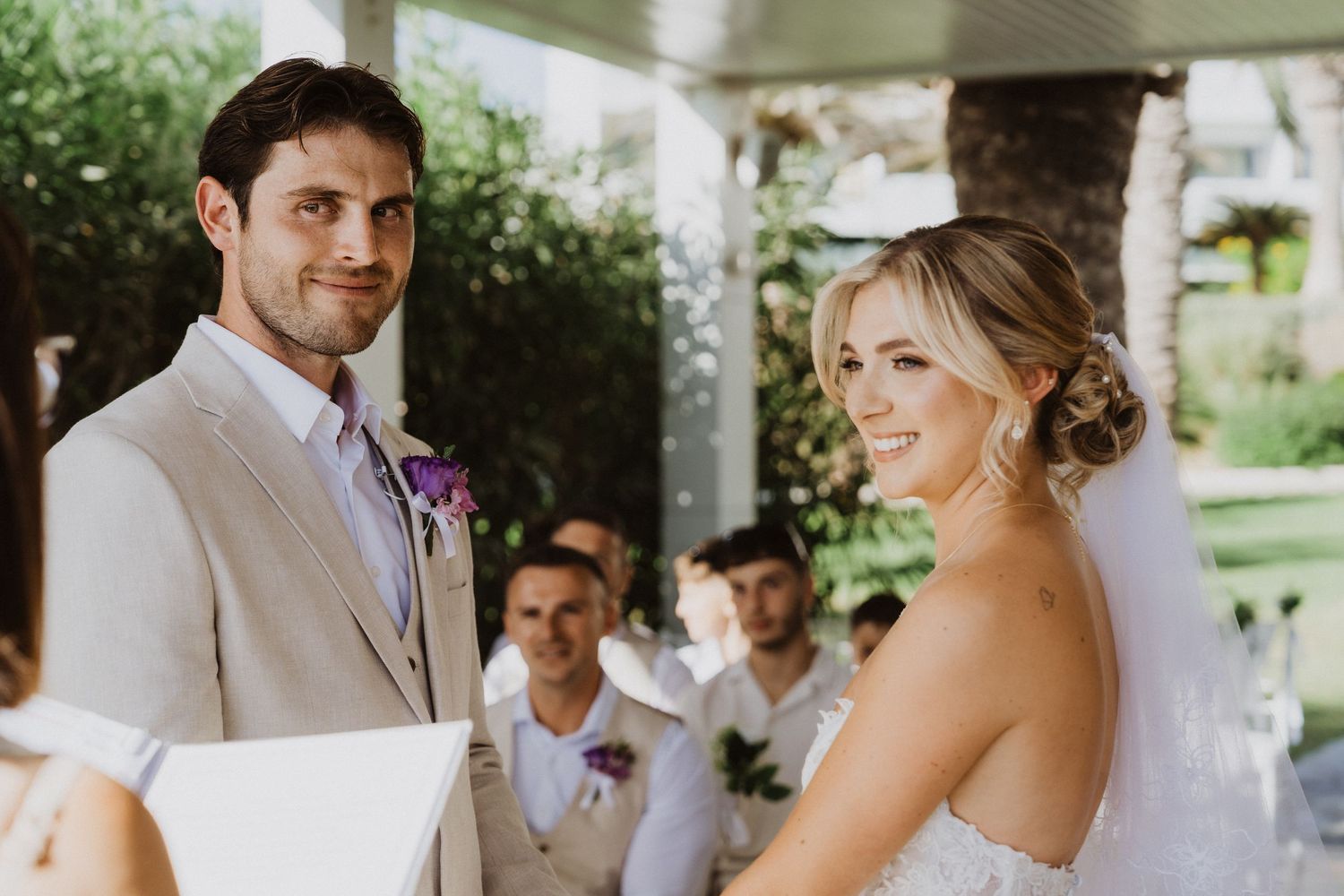 A joyful wedding celebration sequence showing a couple sharing their first dance under a covered patio.
