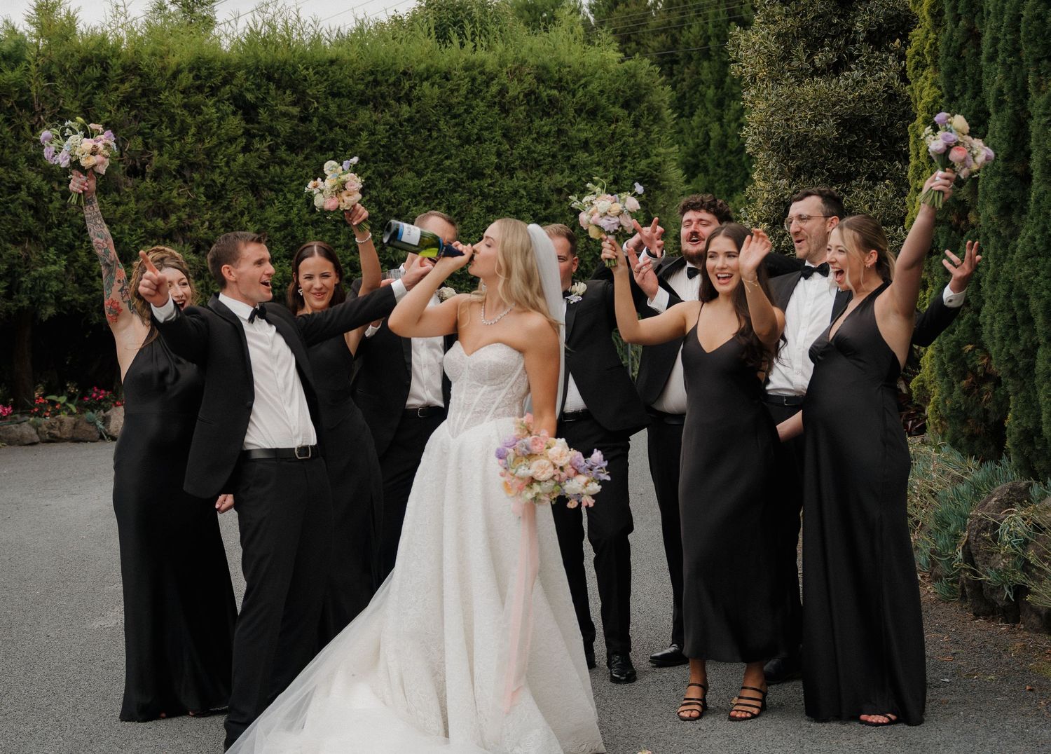 Bridal party cracking open a champagne and having some fun!
