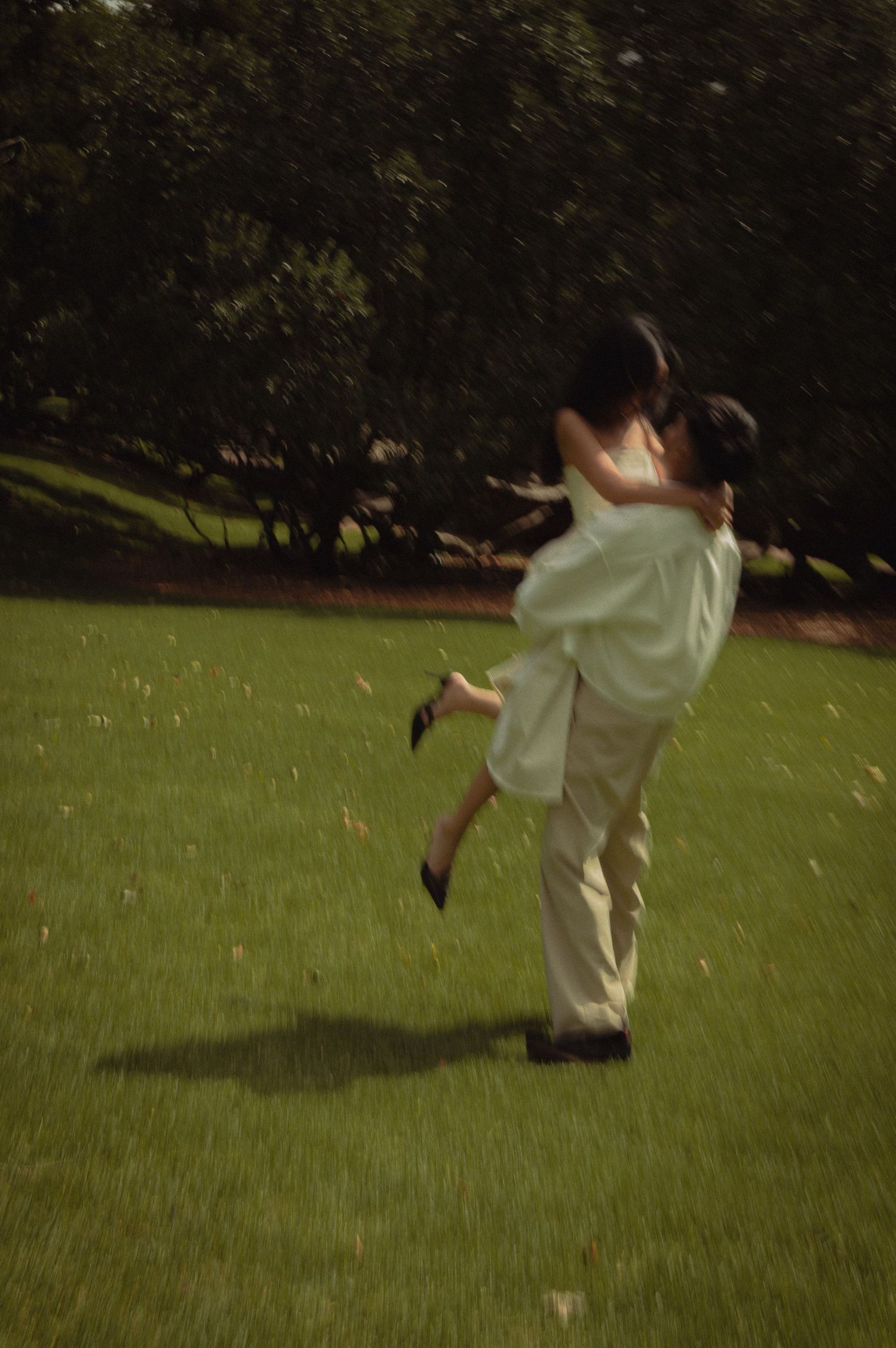Engaged couple spinning around creating memories using movement images