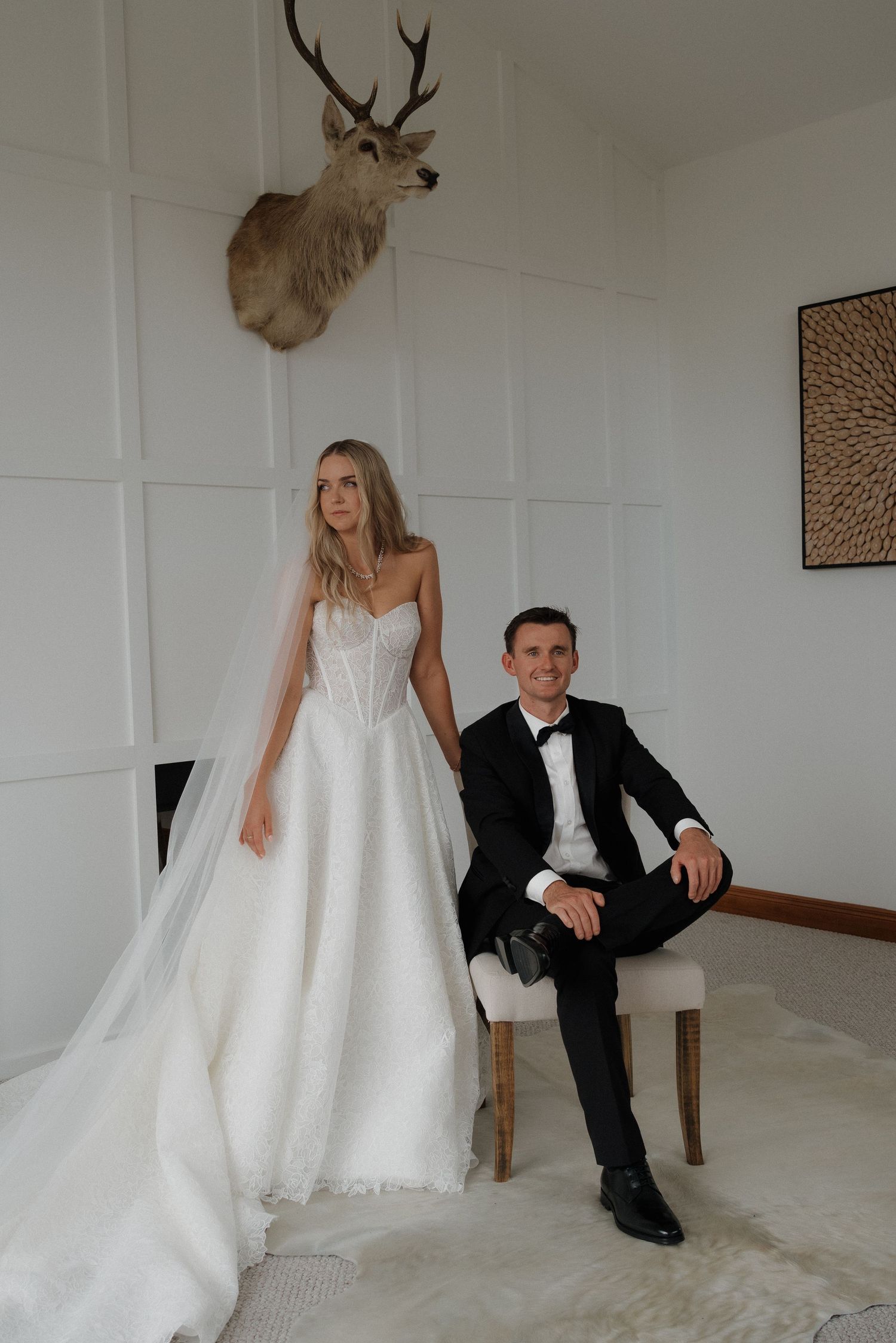 Bride and Groom posing in the living room after their first look