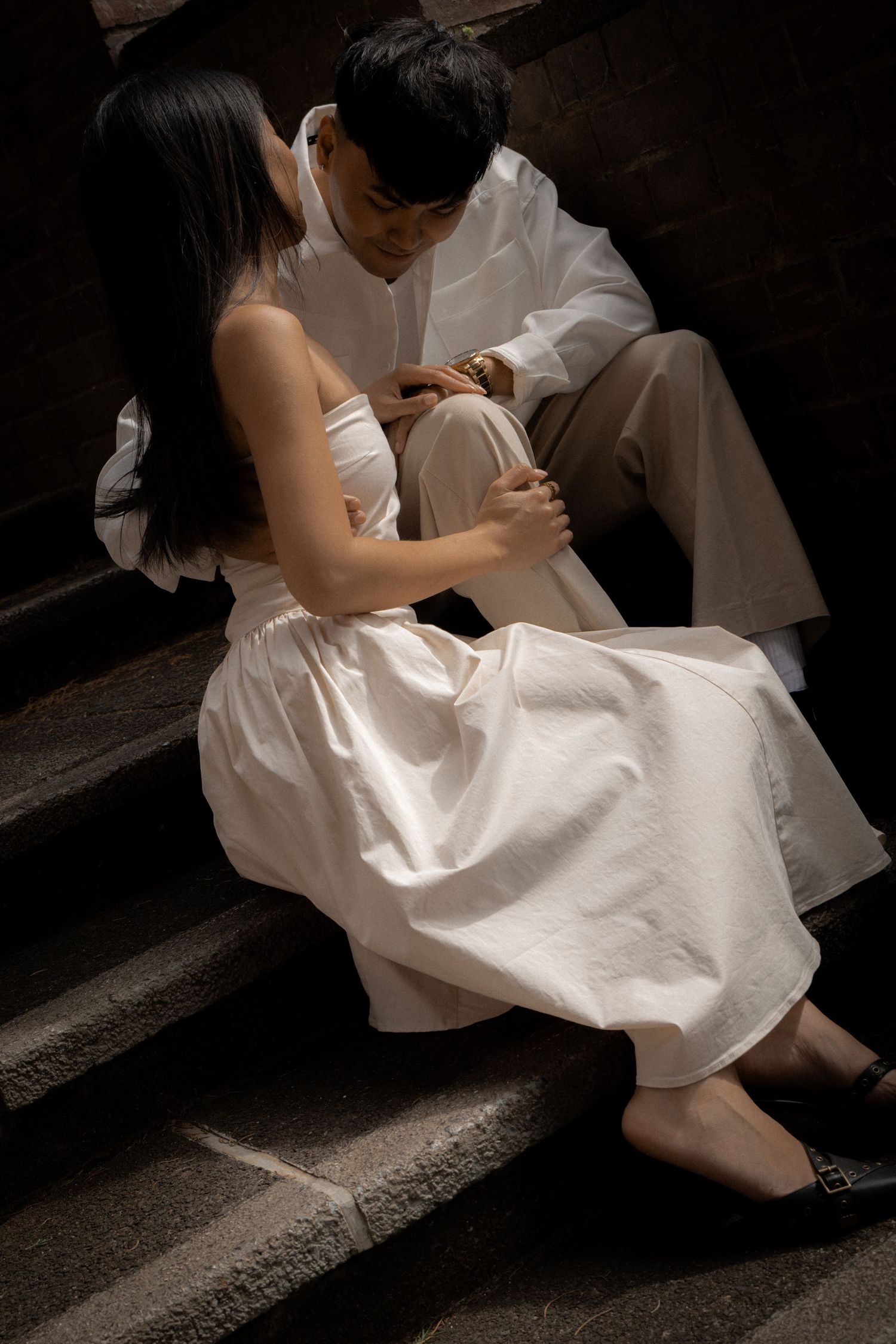 Romantic shot of a couple sitting on the stairs