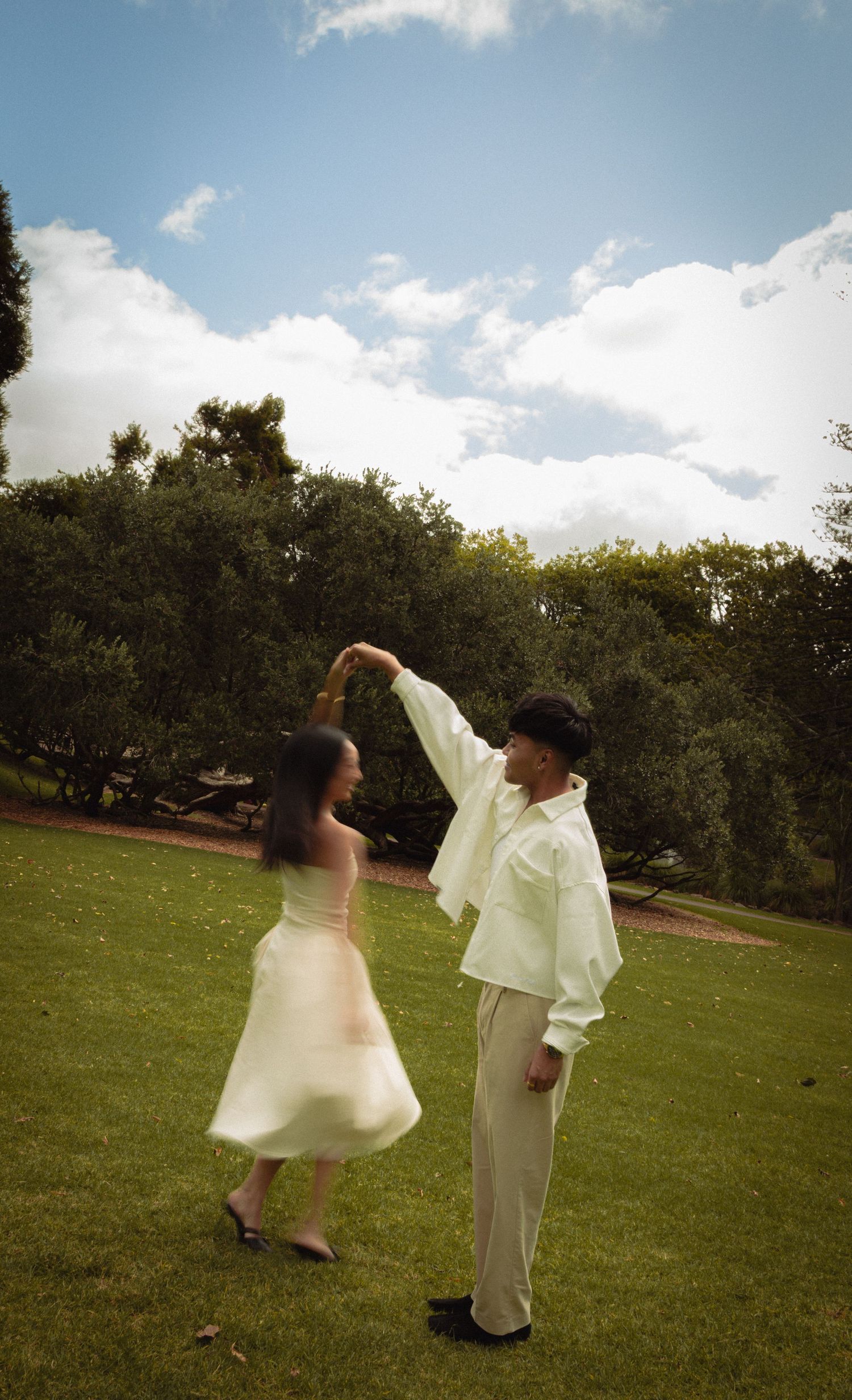 Fiance's dancing in the middle of a garden in Auckland