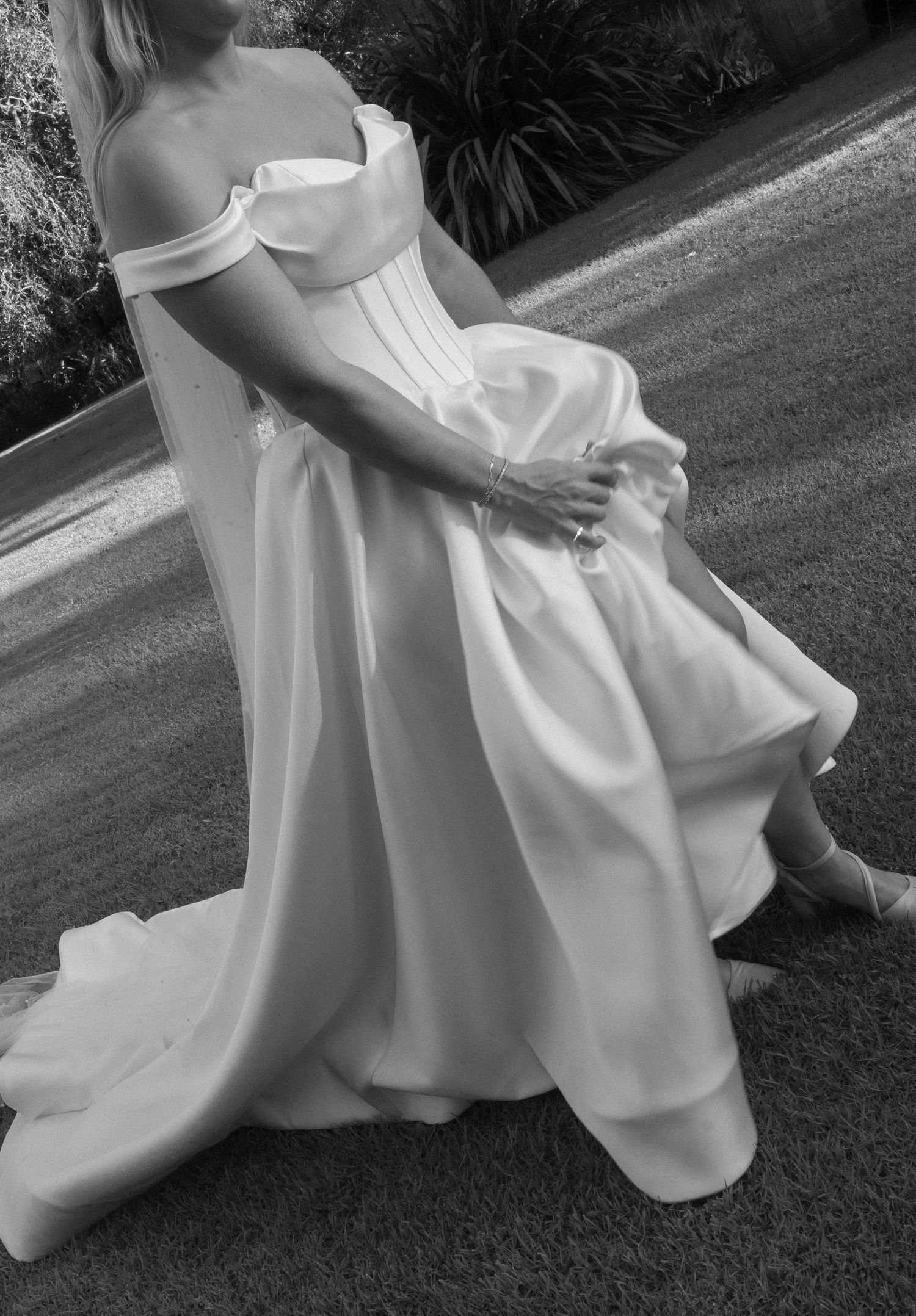 Bride holding her dress up and running
