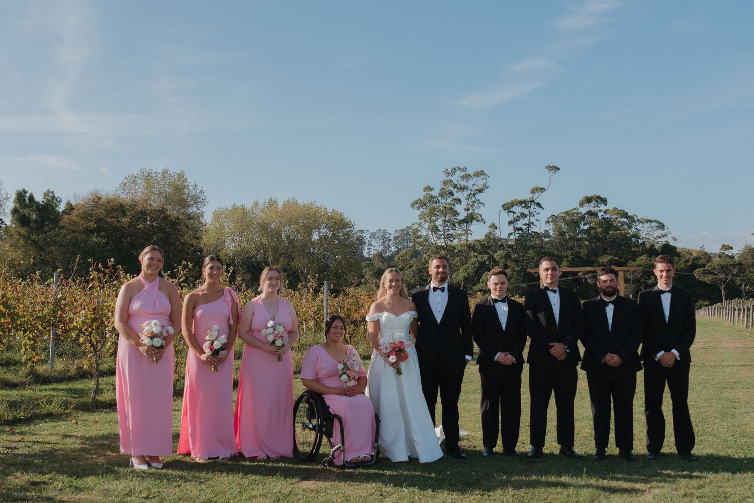 Bride and Groom's bridal party at hunting lodge auckland in black and pink