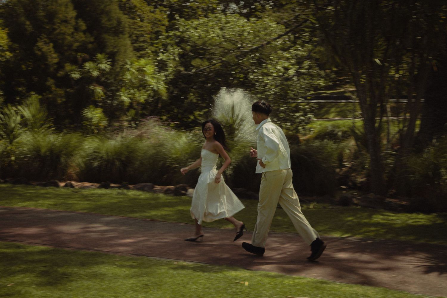 Couple running away together creating a natural fun shot