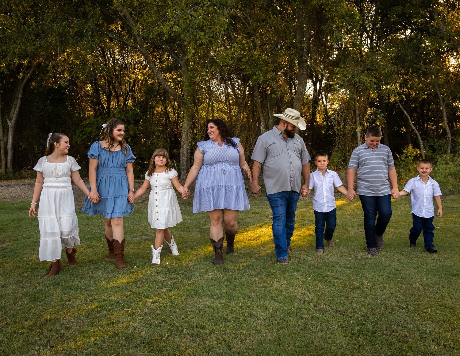 Family walking together during photo session in Parker Texas