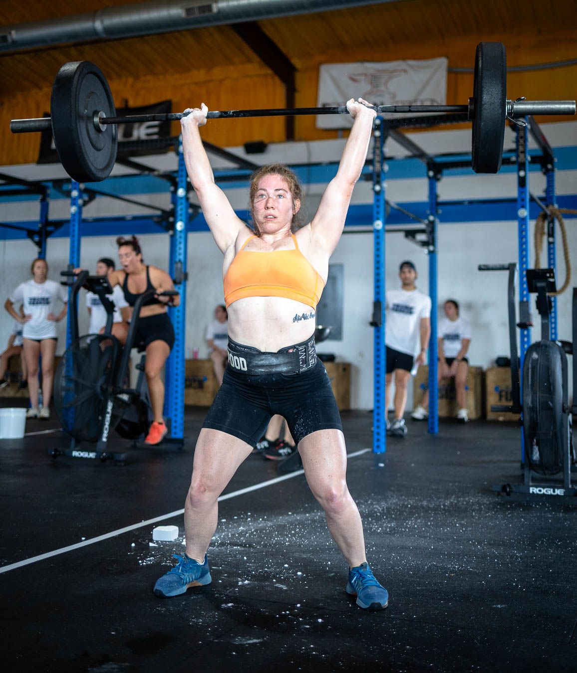 Athlete lifting barbell during Fusion Frenzy CrossFit event in Waxahachie Texas