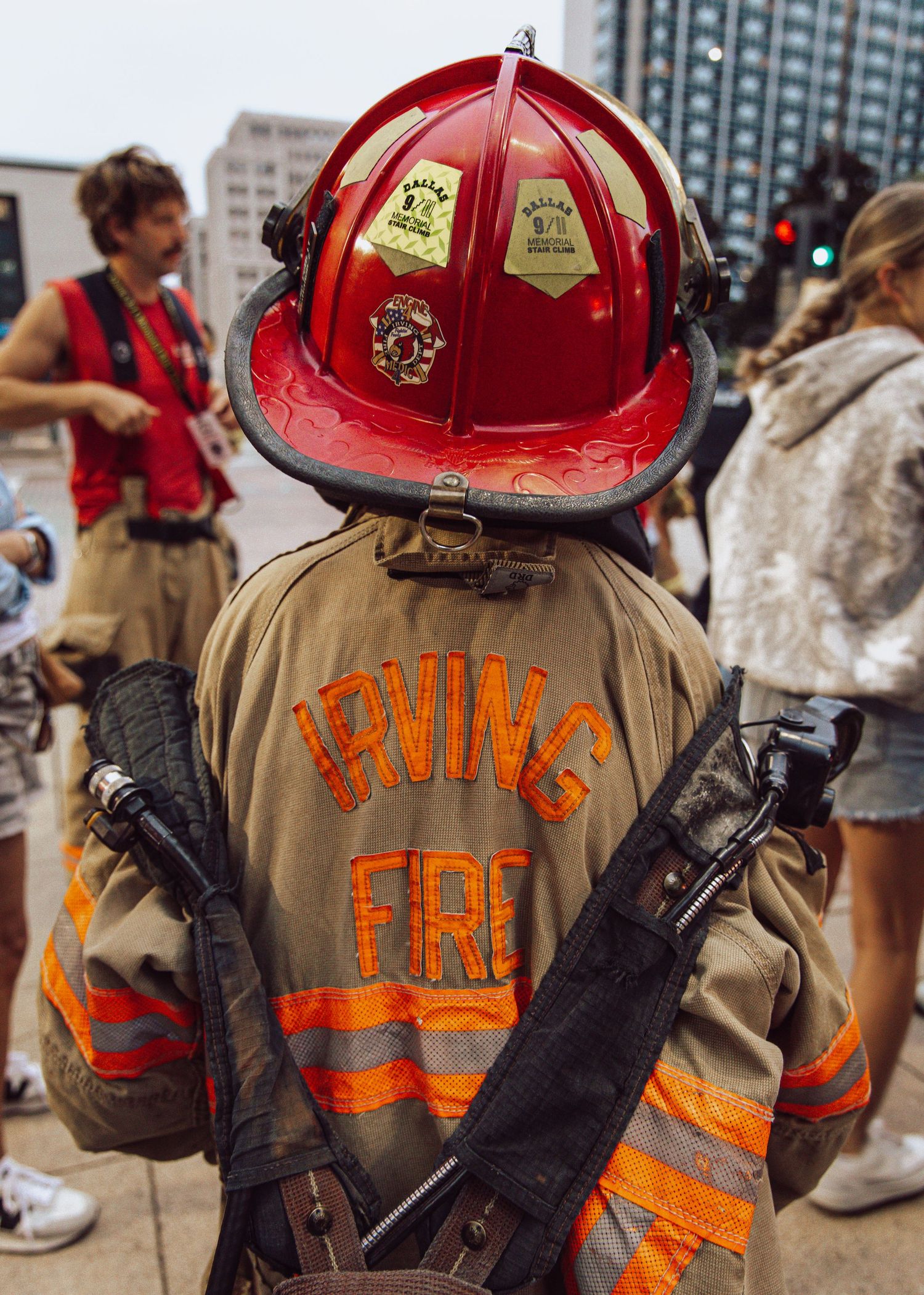 Child of firefighter wearing dads turnouts, Stair climb 9/11 in dallas, Texas