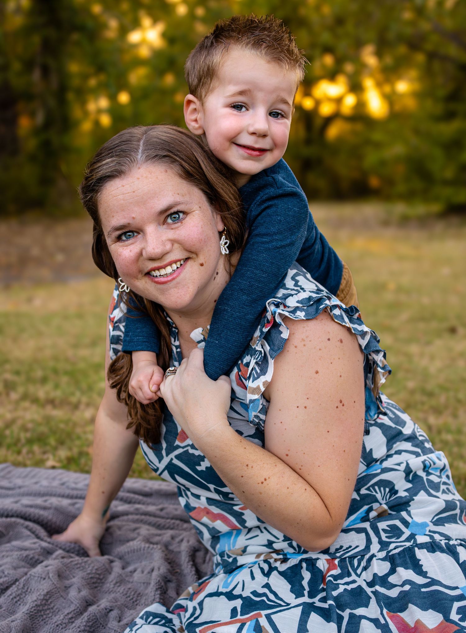 Mom and Son smiling during portrait session in McKinney Texas