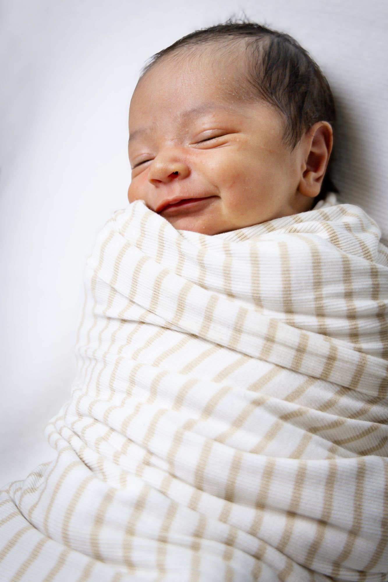 Newborn wrapped in blanket in Princeton Texas