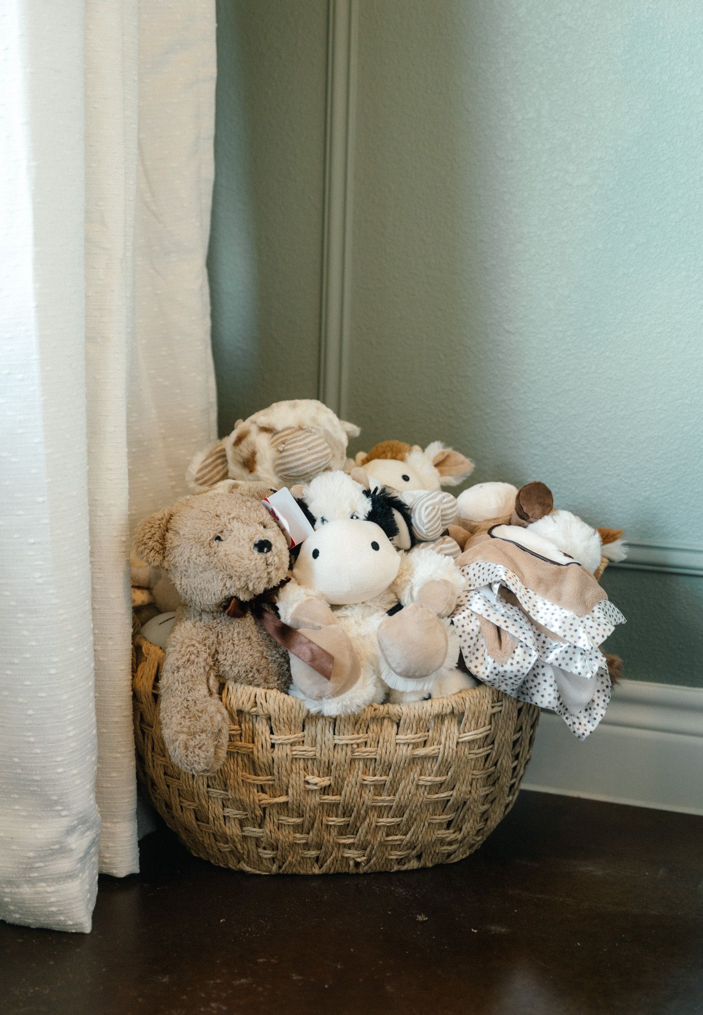 Stuffed animals in the corner of the nursery.
