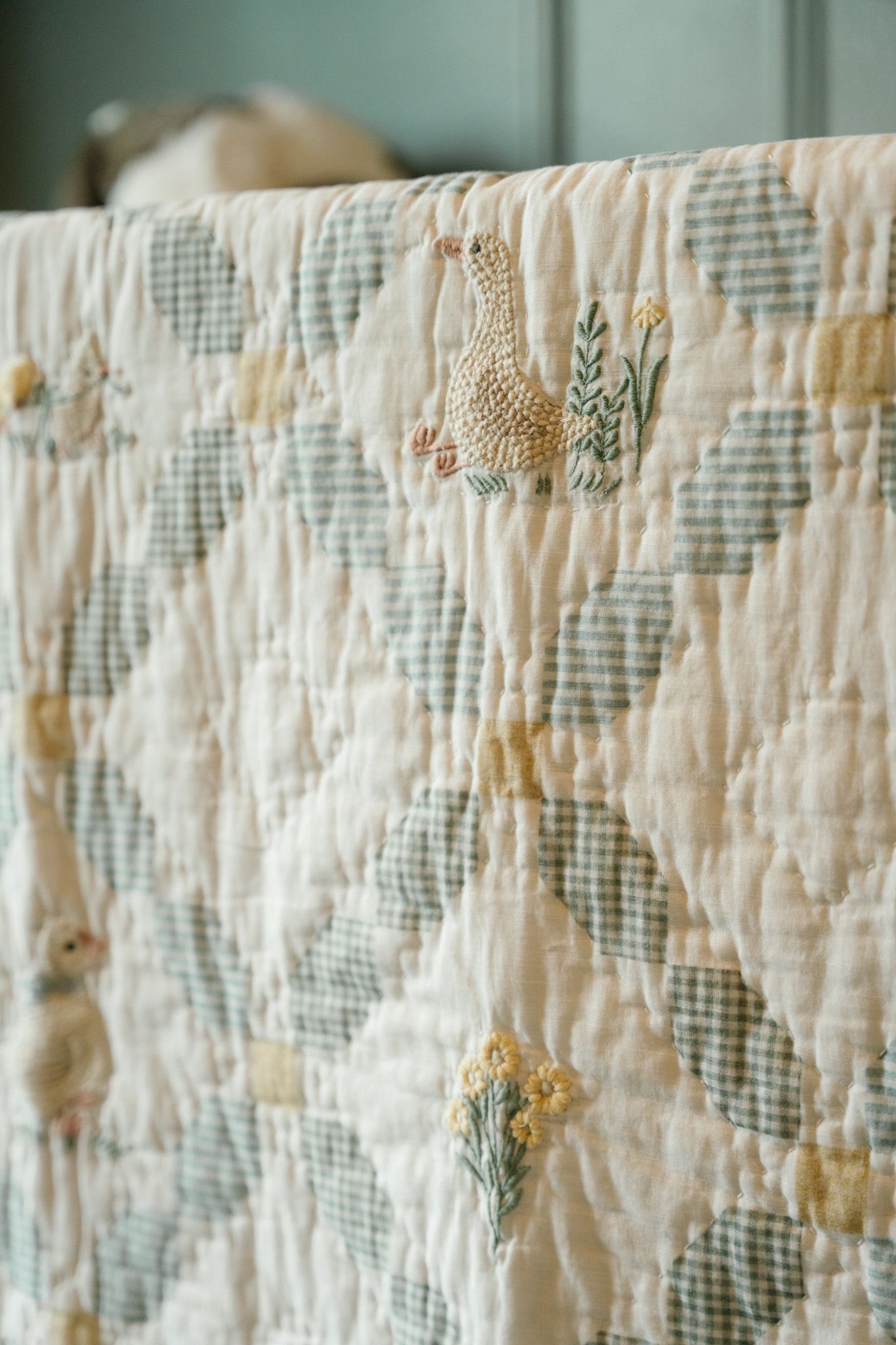 Little chicks embroidered into a baby boy's newborn quilt.