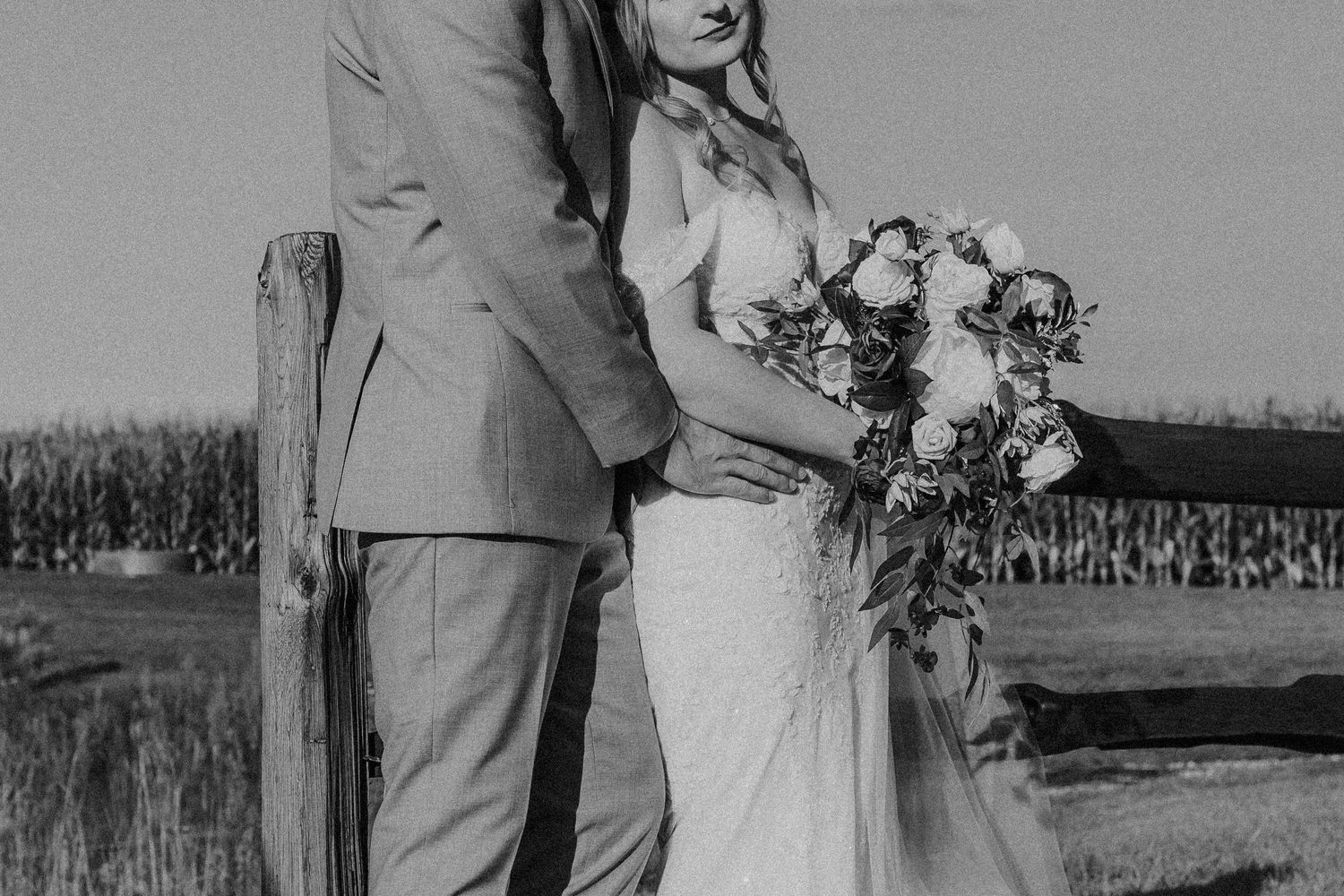A series of black and white wedding photos showing couples embracing outdoors with floral bouquets and formal attire.