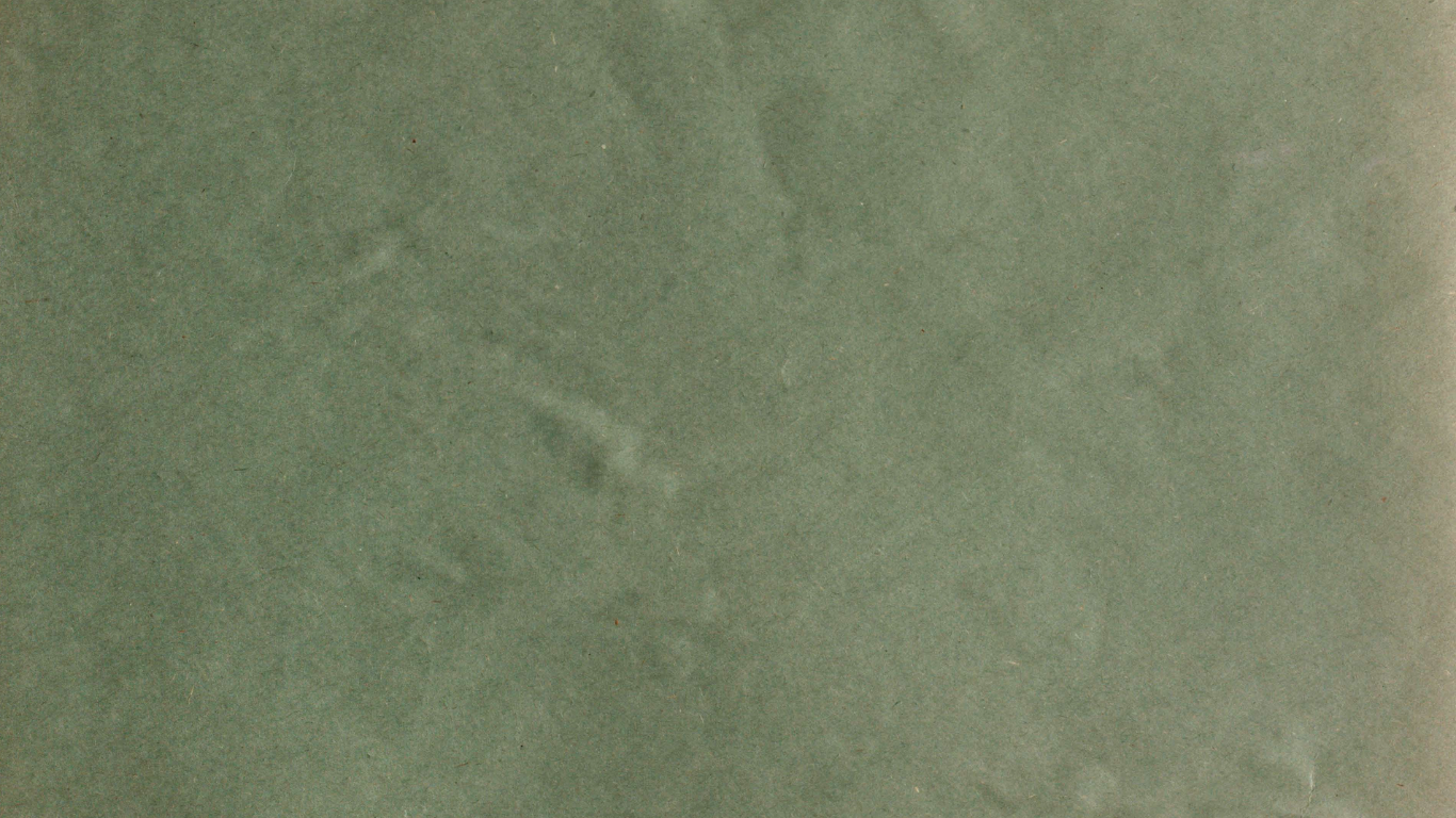 Close-up of smooth sage green marble stone surface with subtle natural veining and mottled texture.