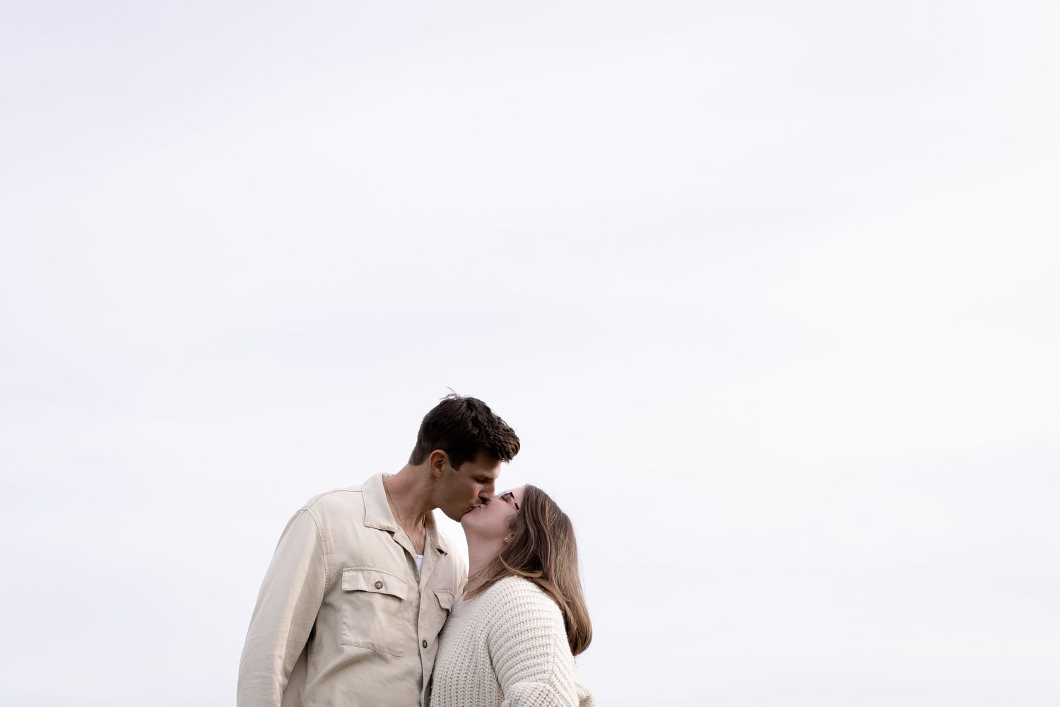 An intimate moment captured against a bright white background.