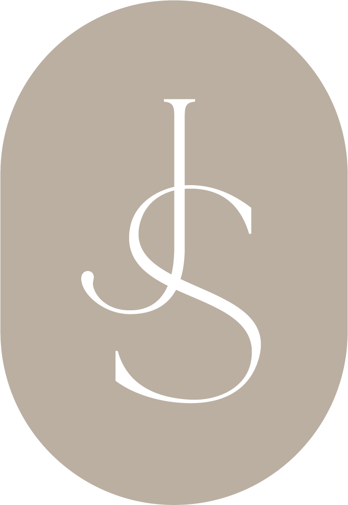 Elegant JS monogram logo in white script on a taupe oval background, perfect for luxury branding.