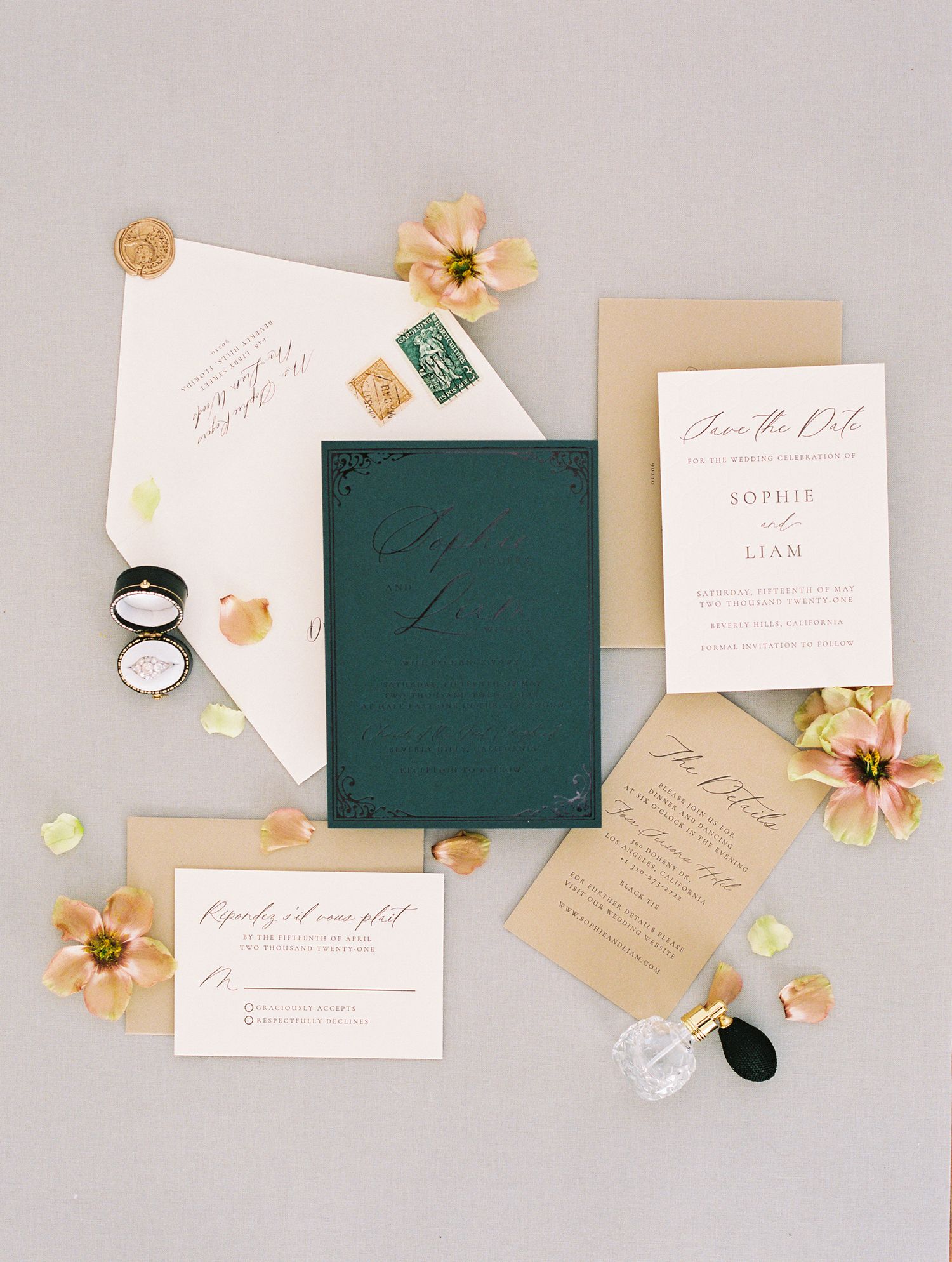 Elegant wedding invitation suite featuring dark green, ivory, and tan cards with calligraphy, gold wax seals, and blush florals.