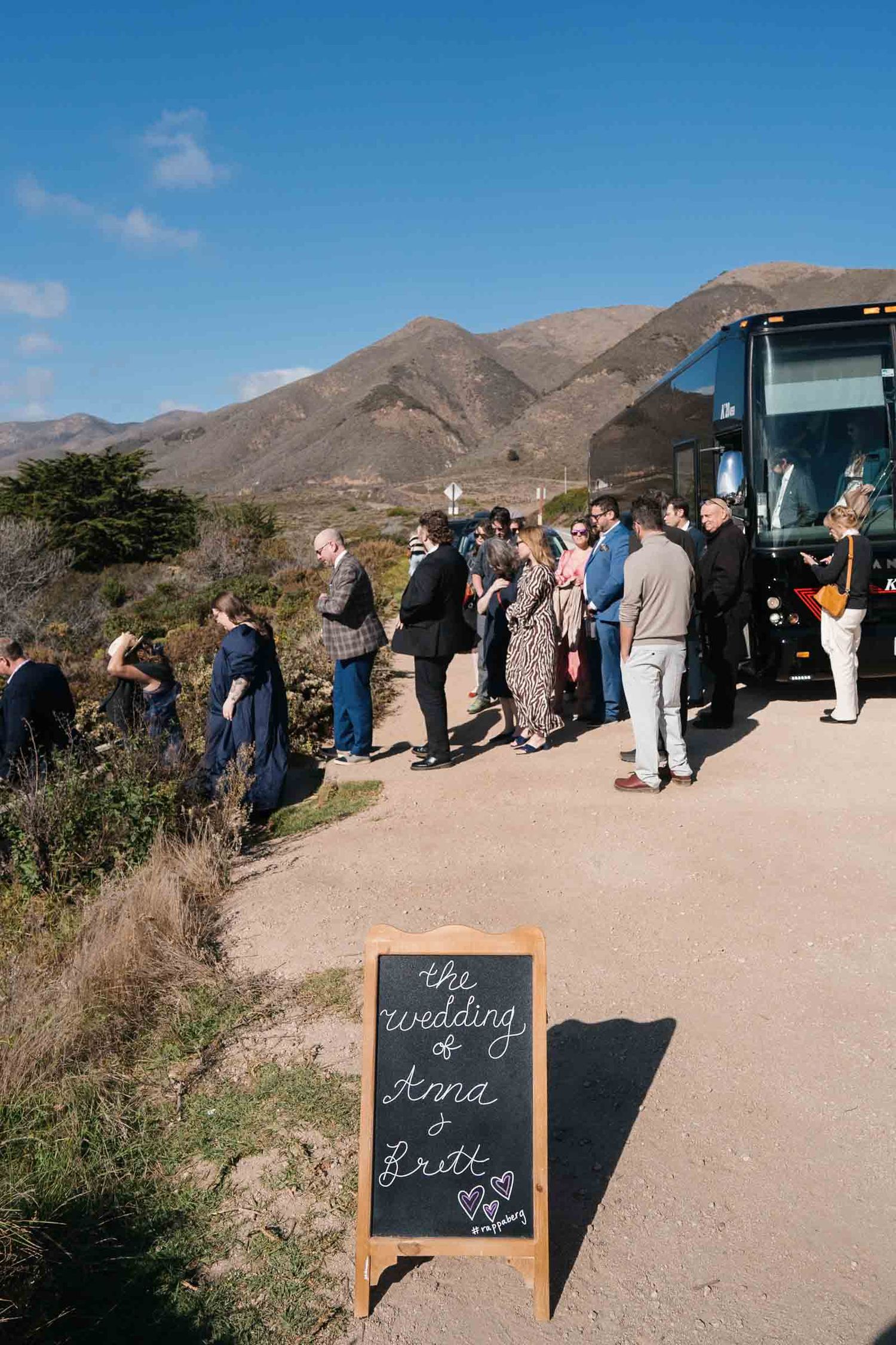 Garrapata beach wedding guests arrive on a shuttle for a big sur wedding ceremony.