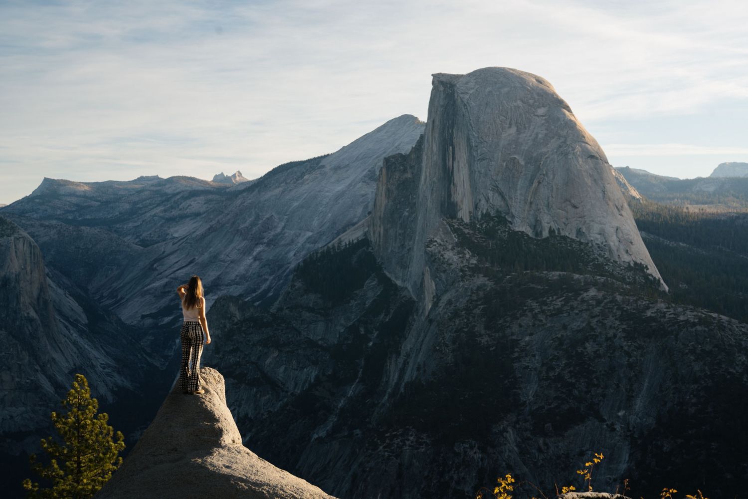 Panoramic mountain landscape from Yosemite National Park's glacier point showing Half Dome at different angles.