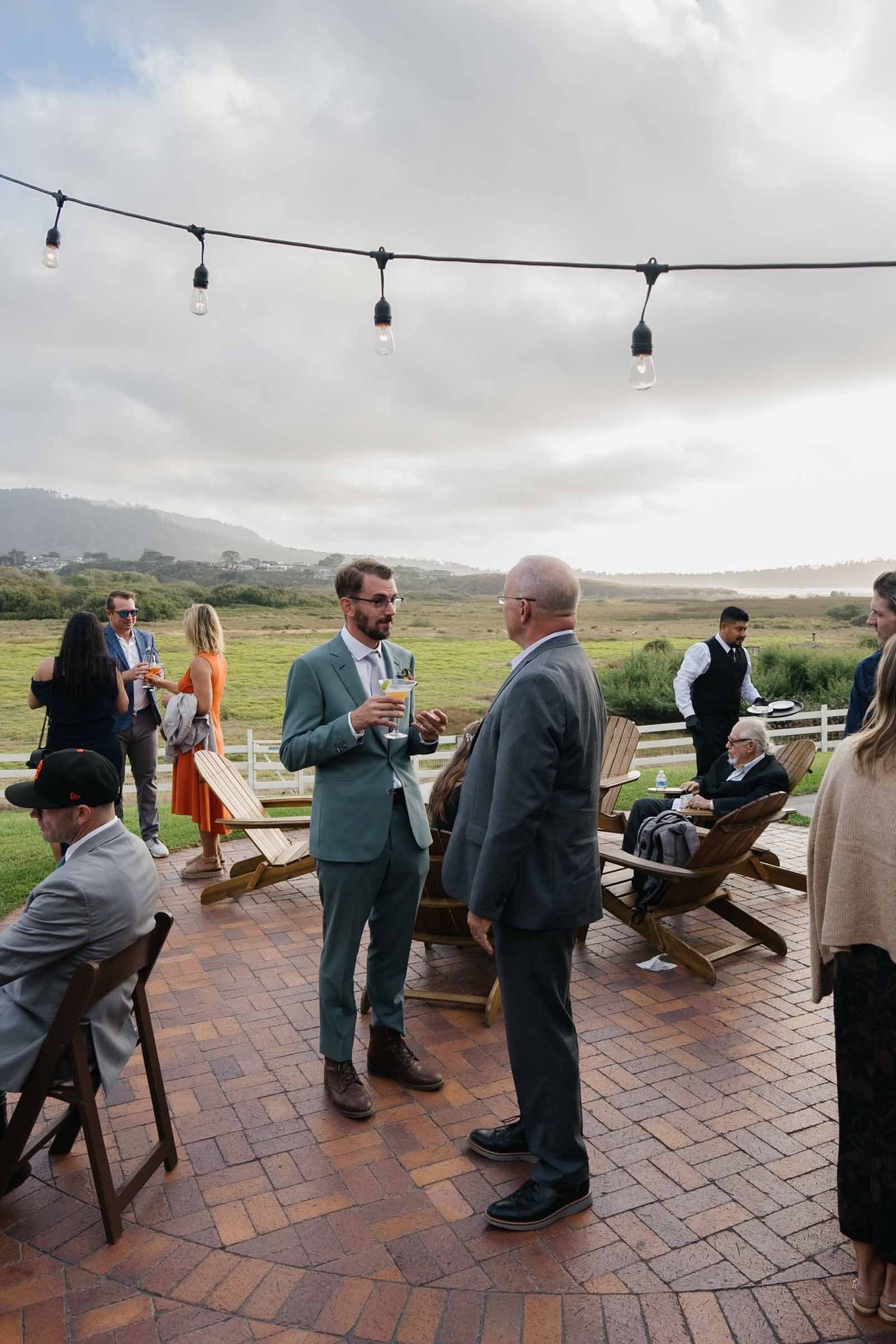 Wedding guests drinking cocktails at carmel's best wedding venue mission ranch.