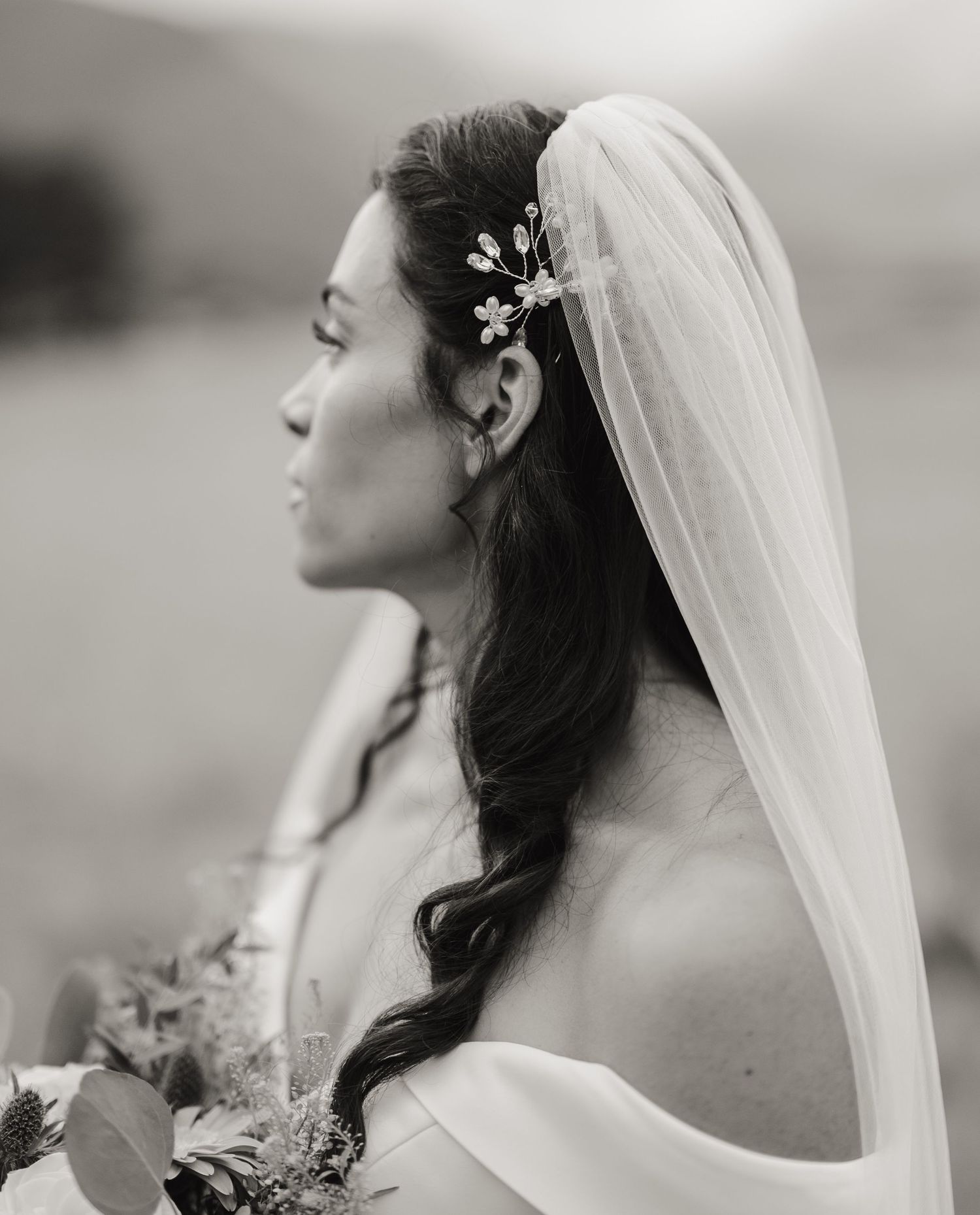 A bride in a flowing white veil is captured in a series of artistic black and white profile portraits.