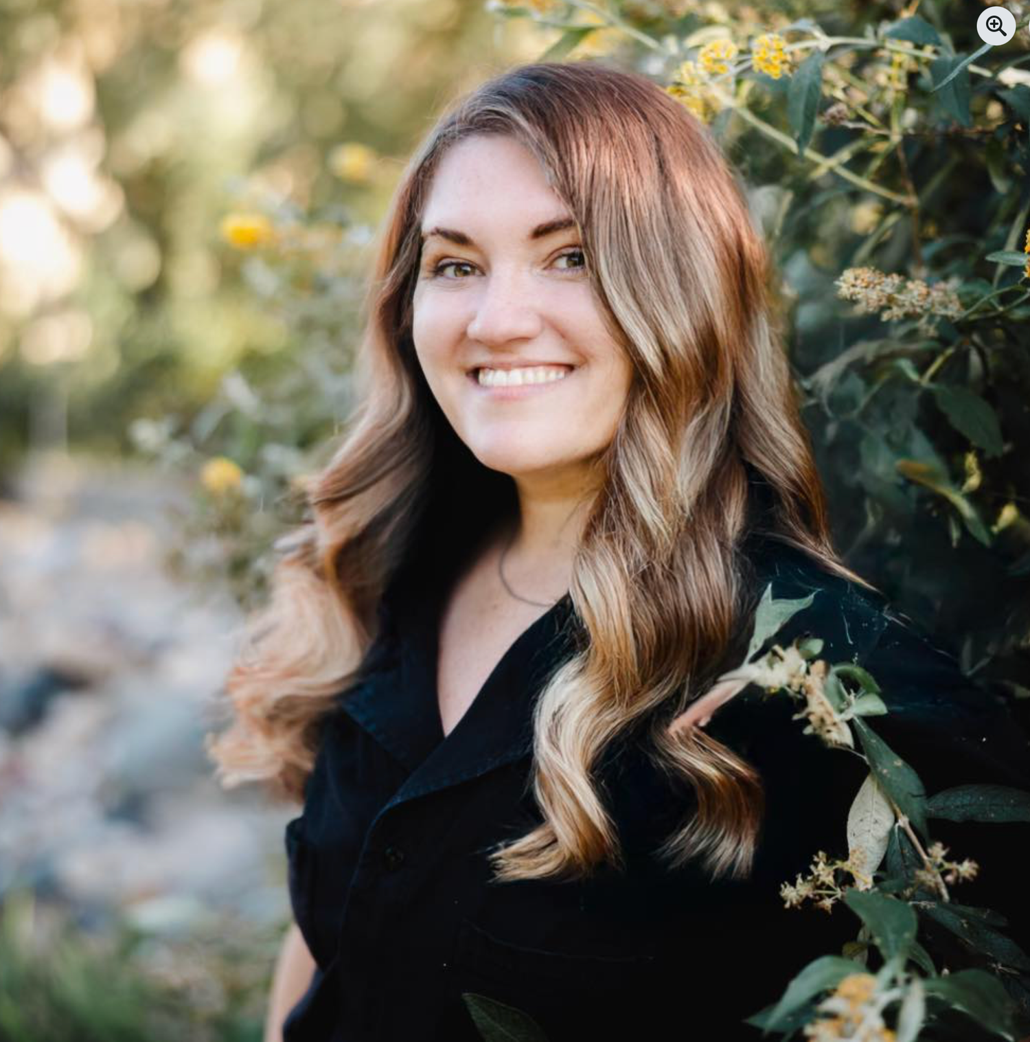 A portrait series in a garden setting with fall flowers and natural sunlight creating a warm, golden atmosphere.