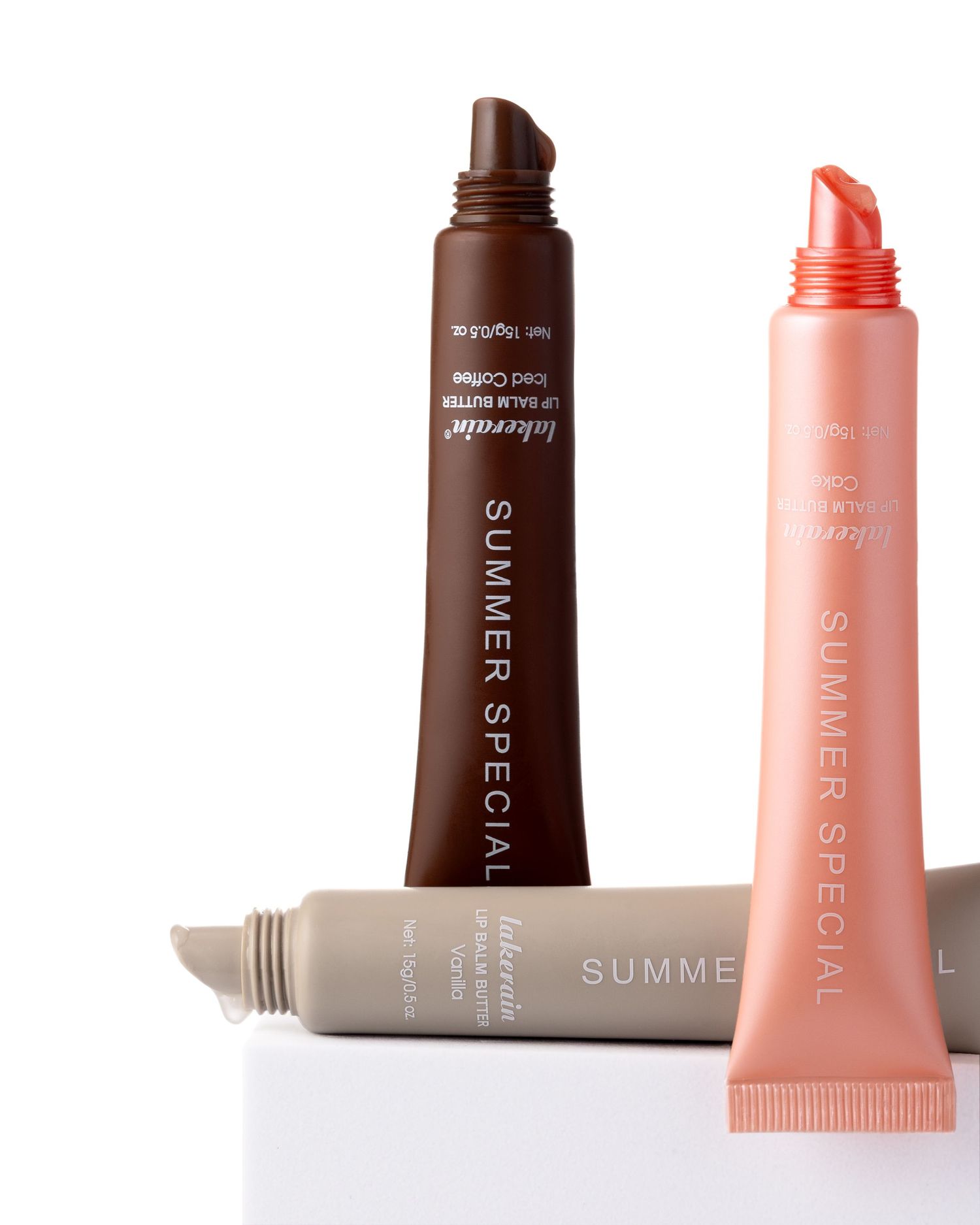 Three Lakerain Summer Special lip balm butter tubes in nude, chocolate, and coral shades displayed together.