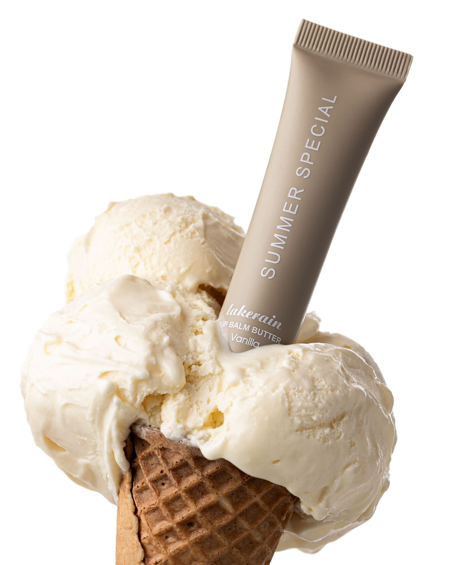 Summer Special lip balm butter tube inserted into a vanilla ice cream cone on white background.