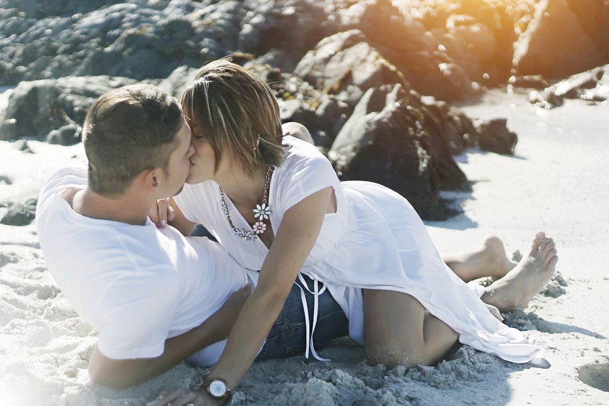 Engagement lifestyle photography session on Camps Bay beach at golden hour in Cape Town