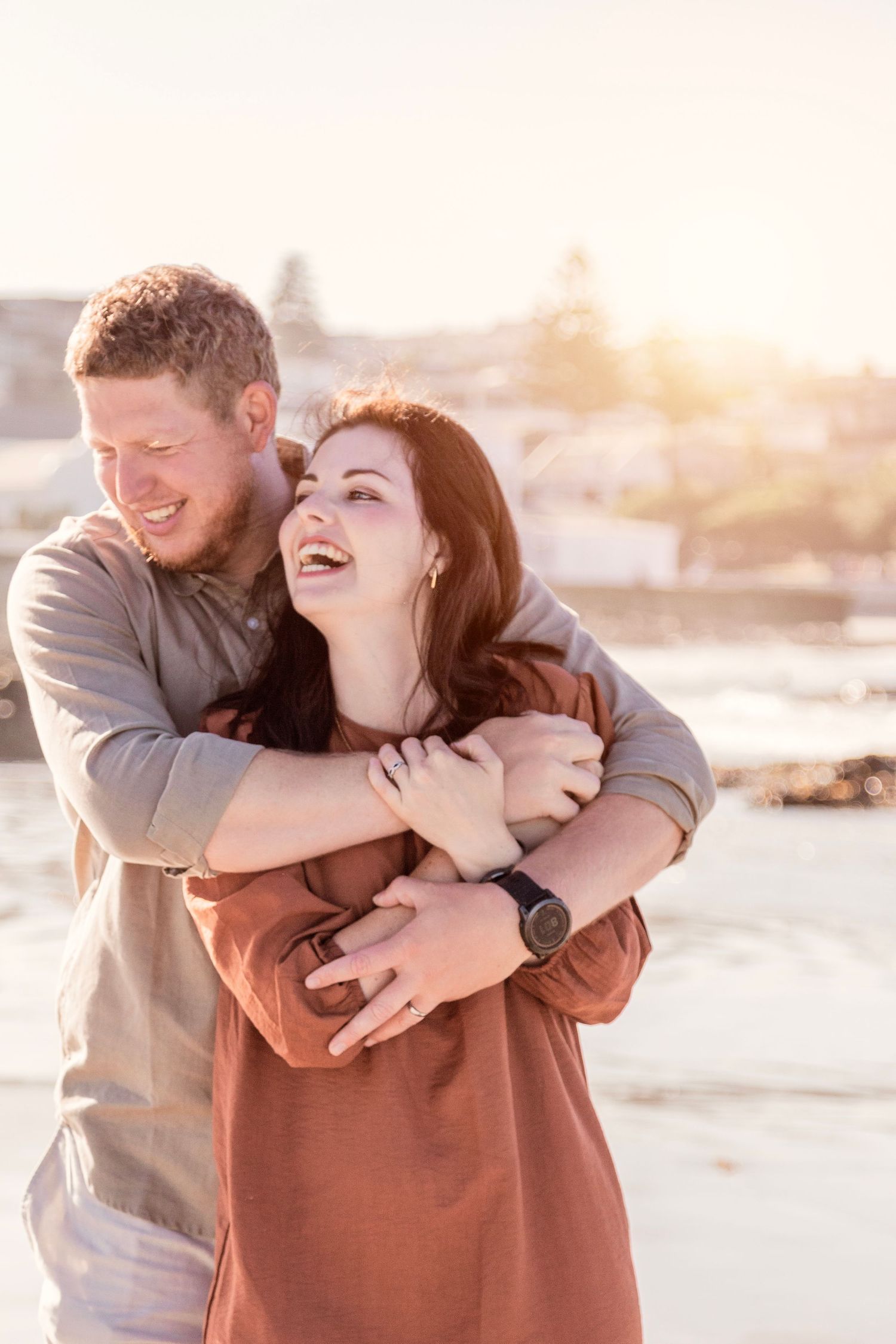 Candid family lifestyle photography session on Camps Bay beach at golden hour in Cape Town