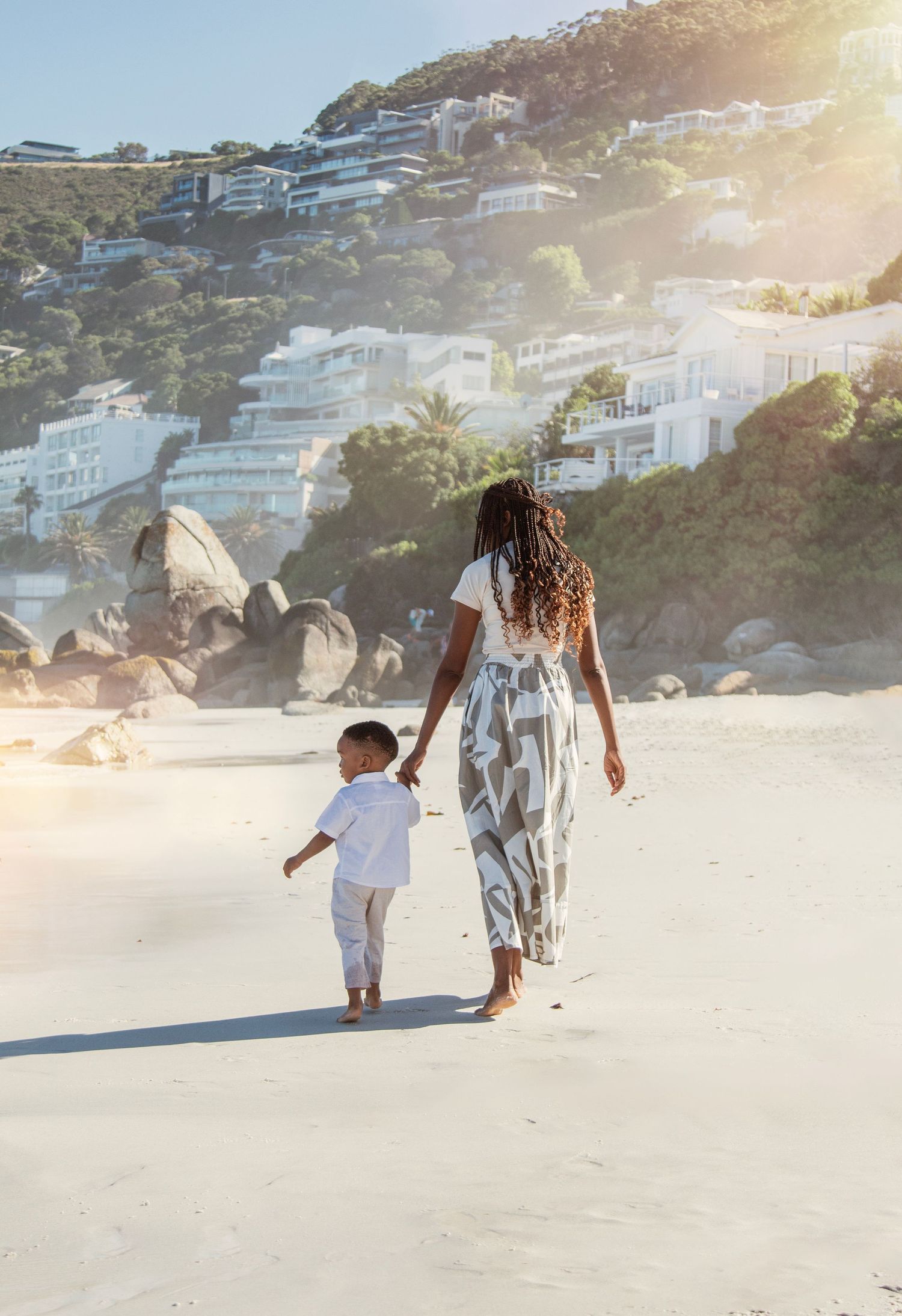 Candid family lifestyle photography session on Camps Bay beach at golden hour in Cape Town