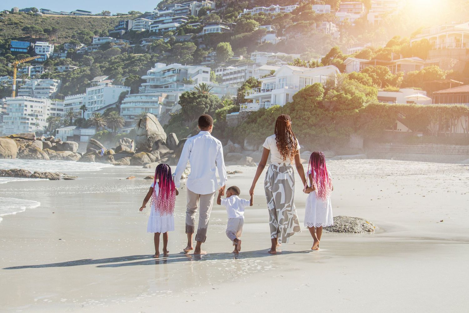 Candid family lifestyle photography session on Camps Bay beach at golden hour in Cape Town