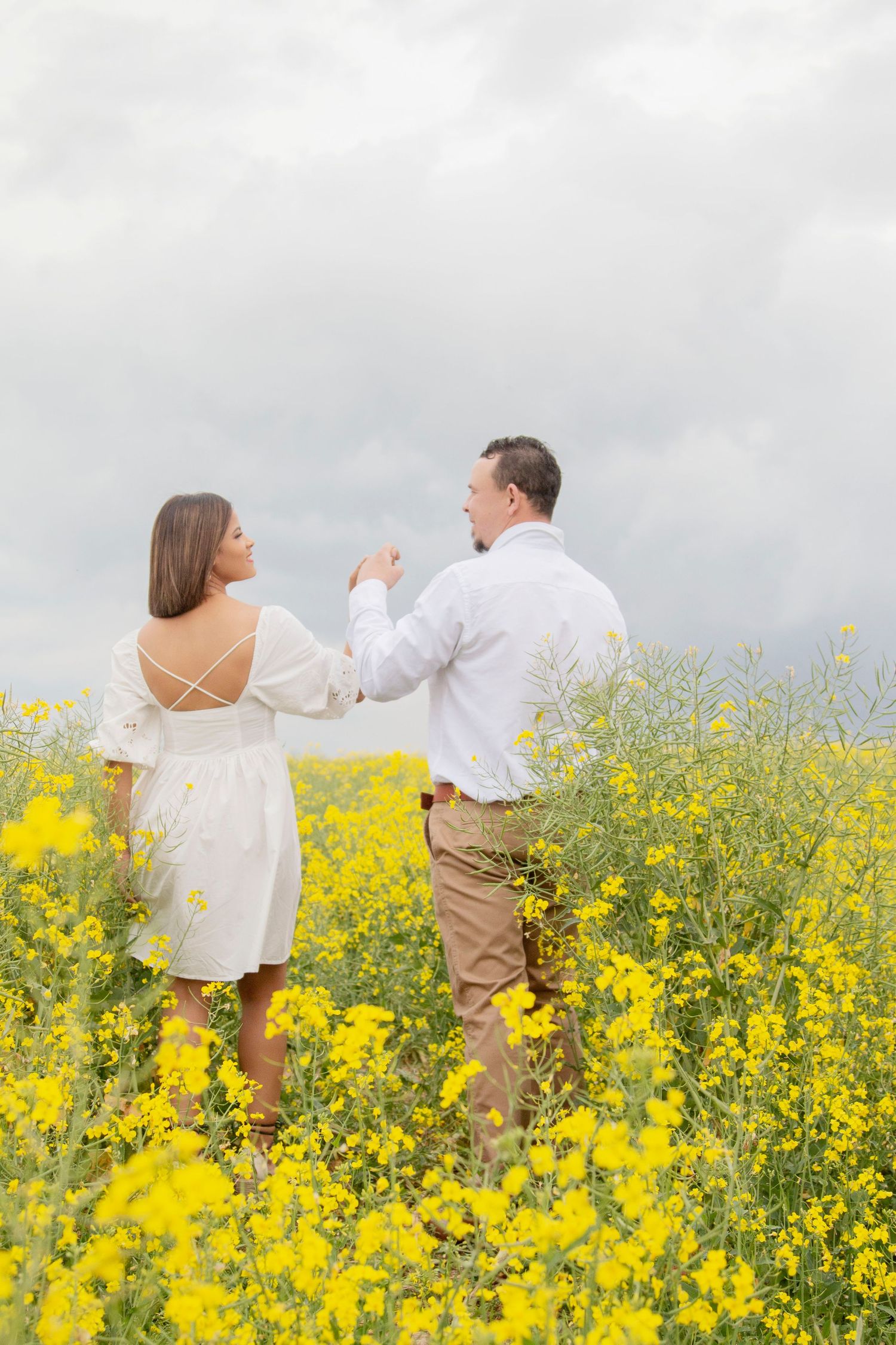 Candid family lifestyle photography session at Canola Field at golden hour in Cape Town