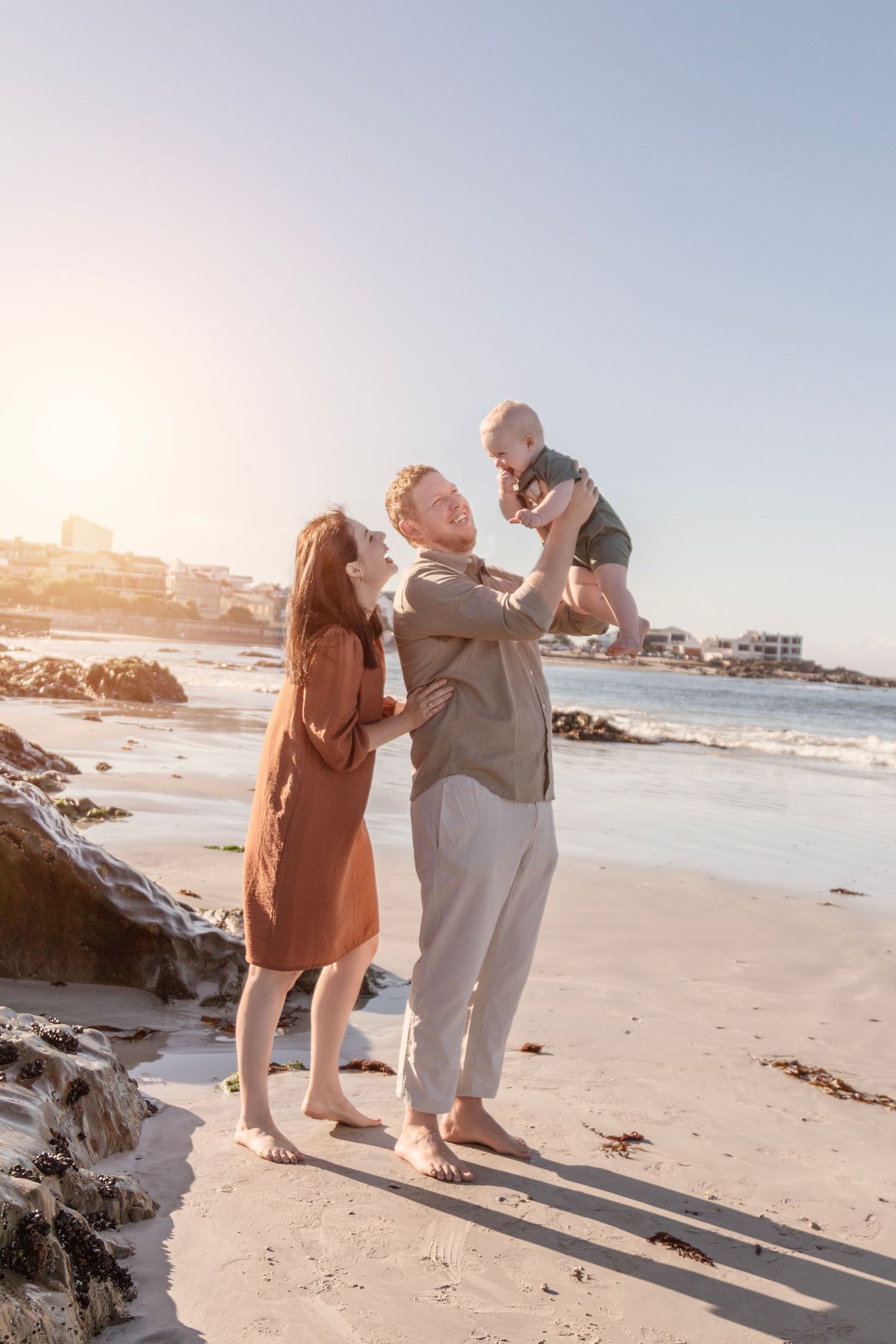 Candid family lifestyle photography session on Camps Bay beach at golden hour in Cape Town