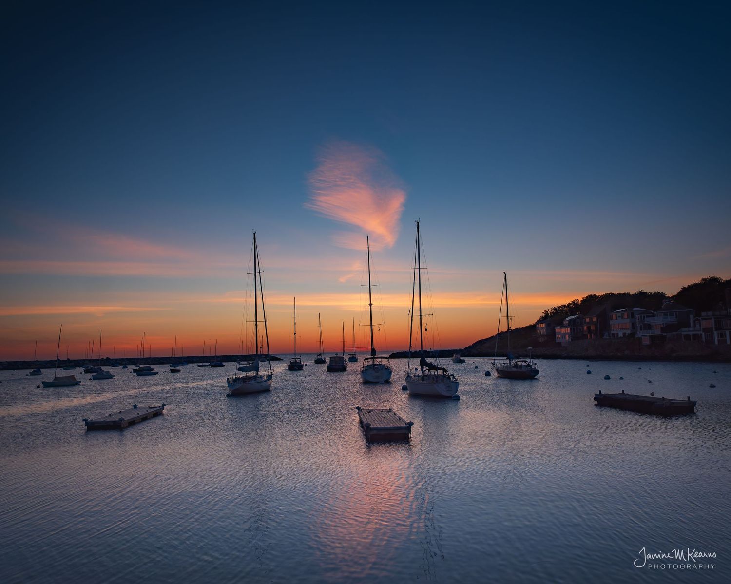 Sunrise at Rockport Harbor, Gloucester, Maine. Sailboats pinky whispy clouds