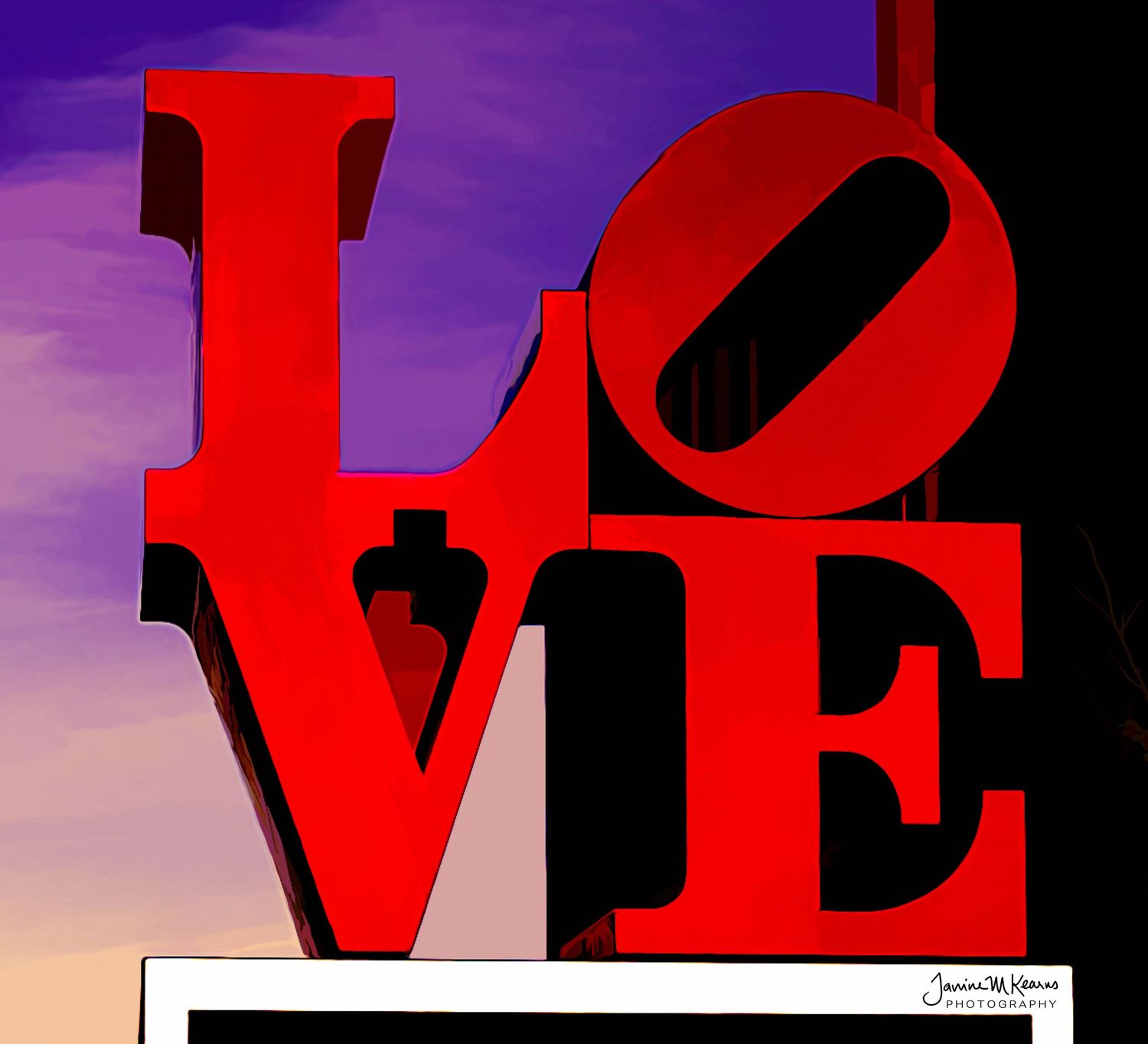Red LOVE sculpture sign against a vibrant purple and orange sunset sky, bold artistic typography.