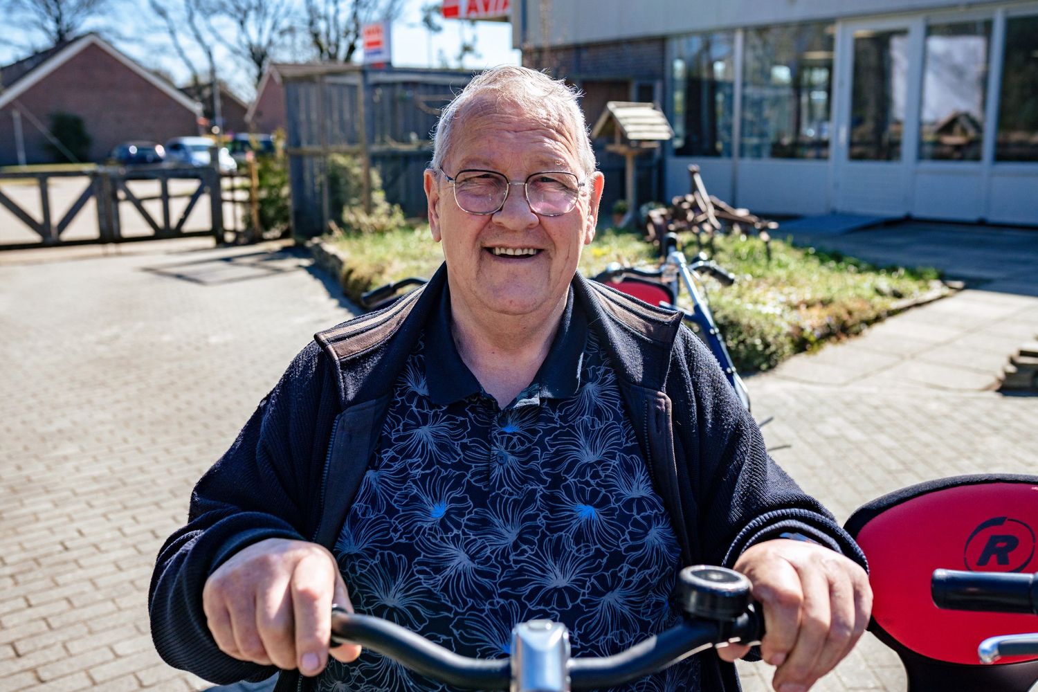 Person enjoying a sunny day while seated on a mobility device outdoors.