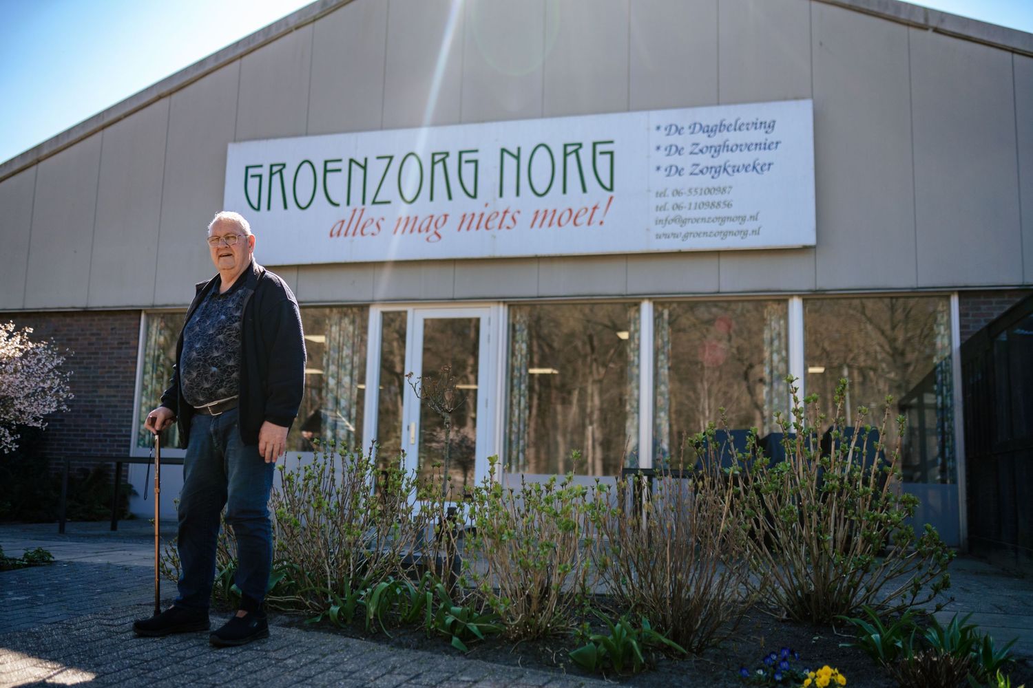 Wide shot of a building exterior with text signage visible.