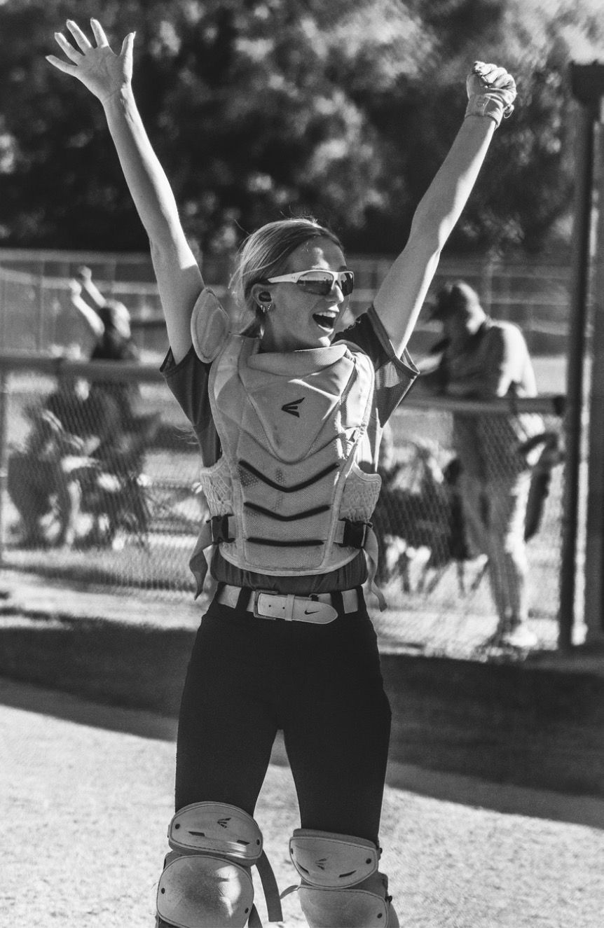 girl playing softball