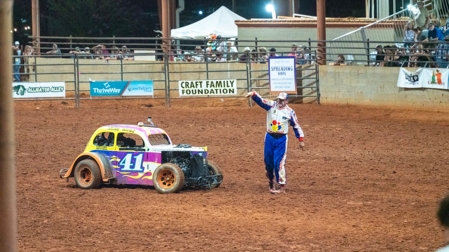 rodeo clown standing outside clown car