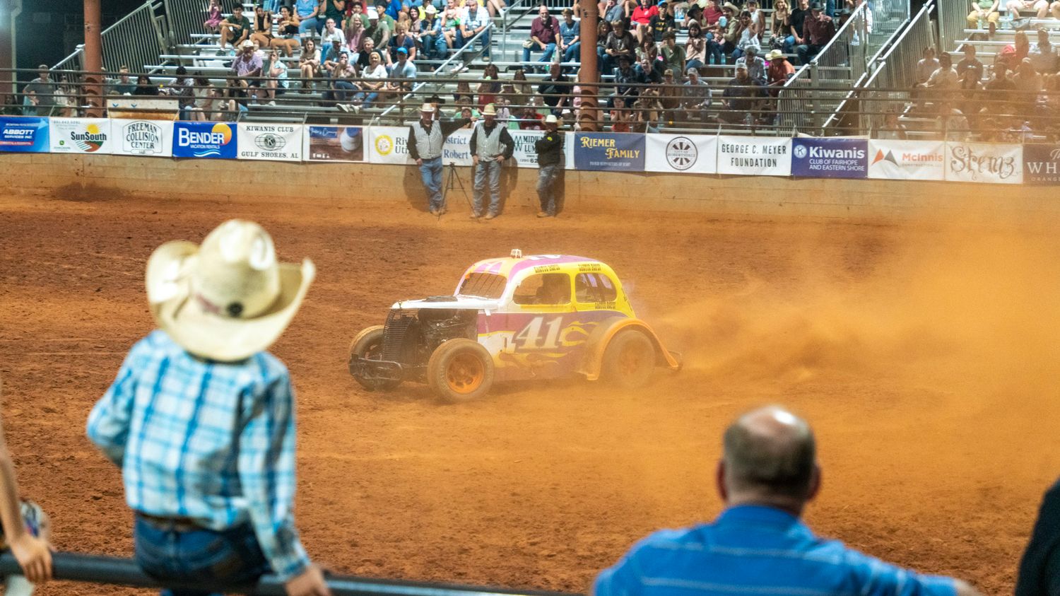 rodeo clown drifts car while people watch