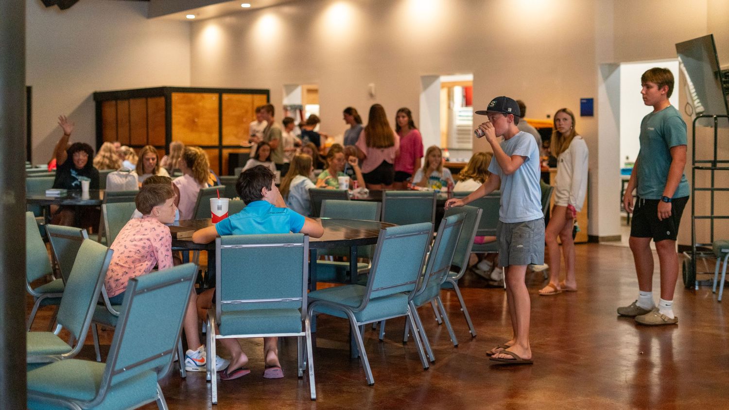 Youth gather and eat dinner